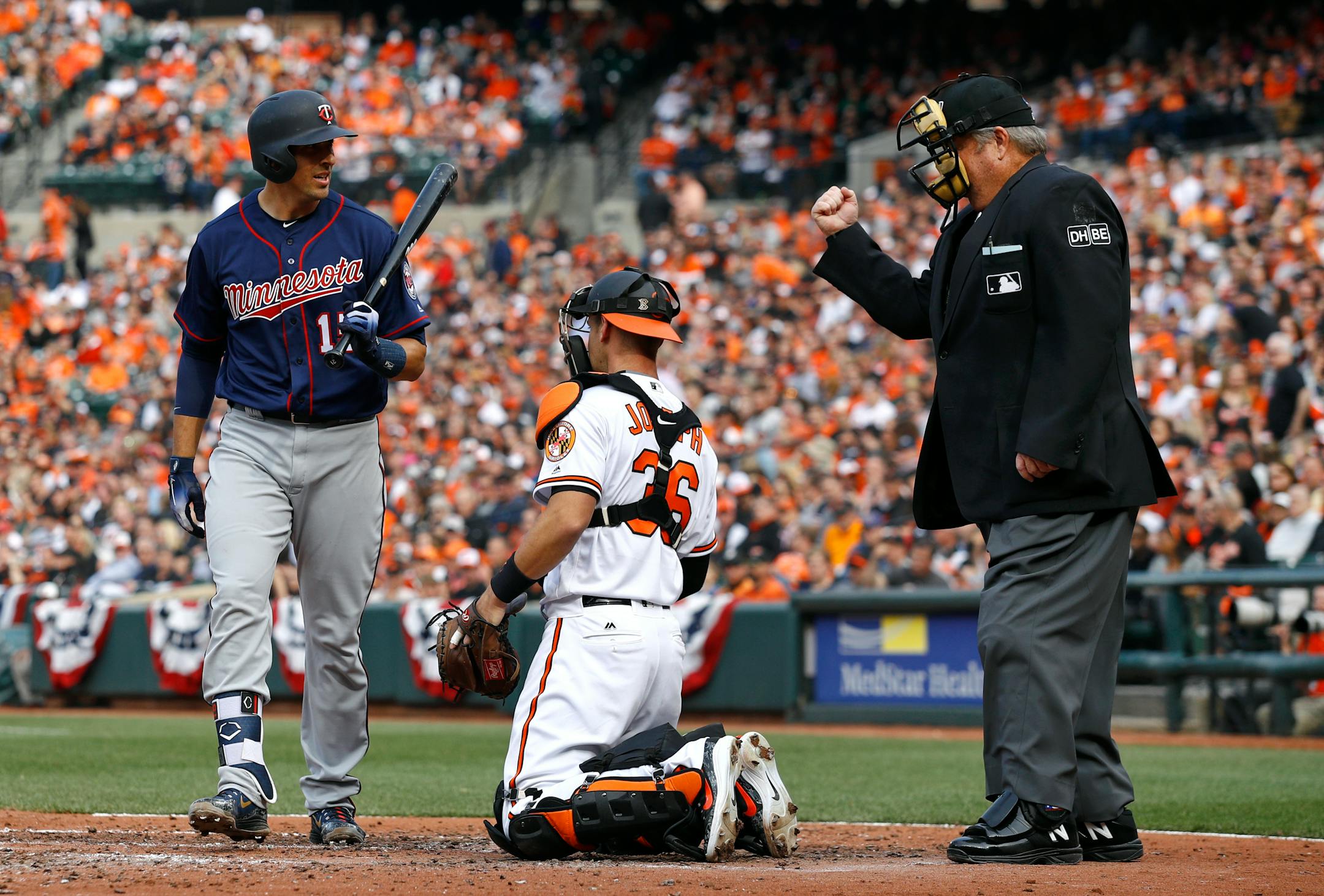 The Twins' Jason Castro walked off the field past Orioles catcher Caleb Joseph and home plate umpire Joe West after striking out in the fifth inning Thursday.