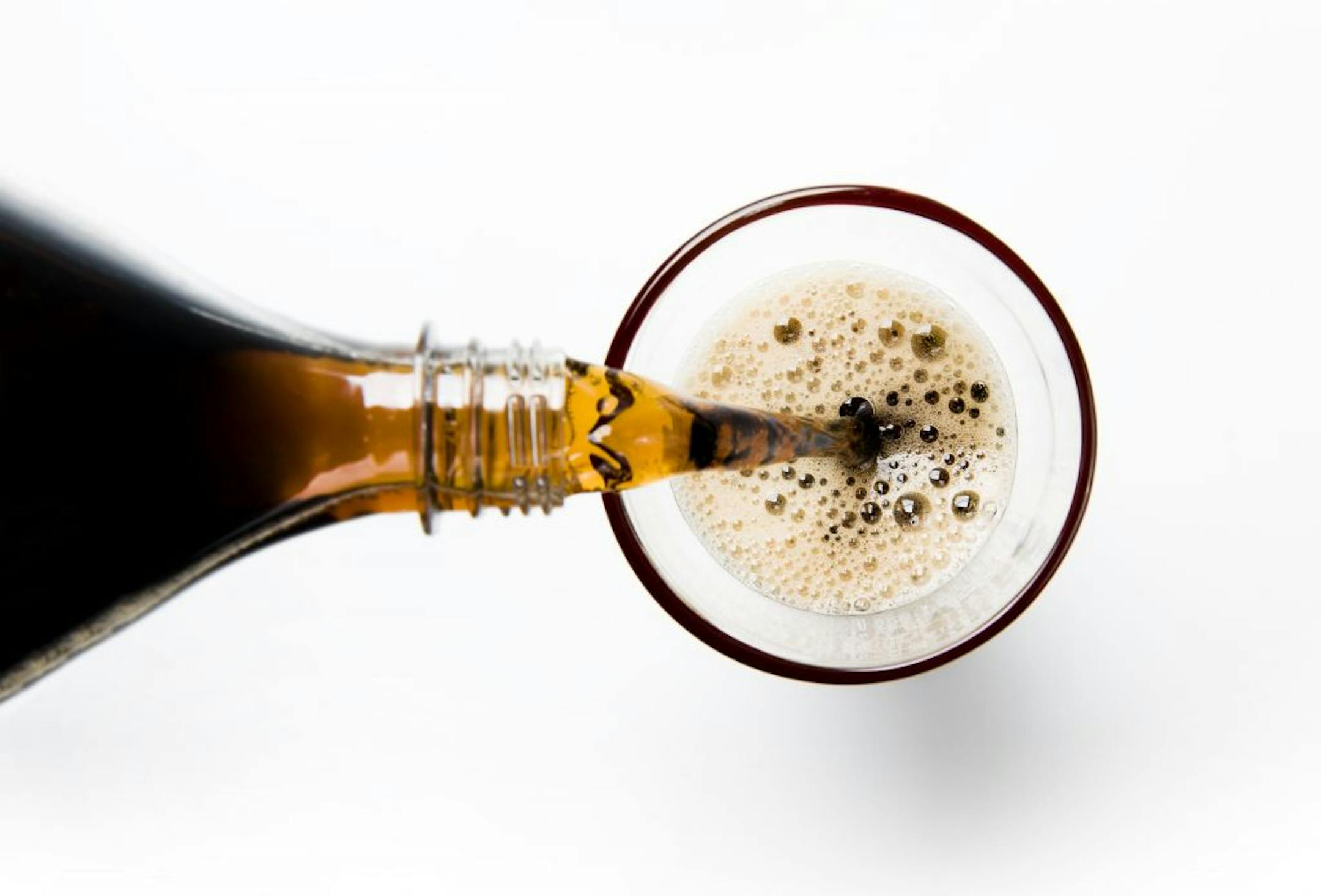 Soda being poured isolated. From iStock.