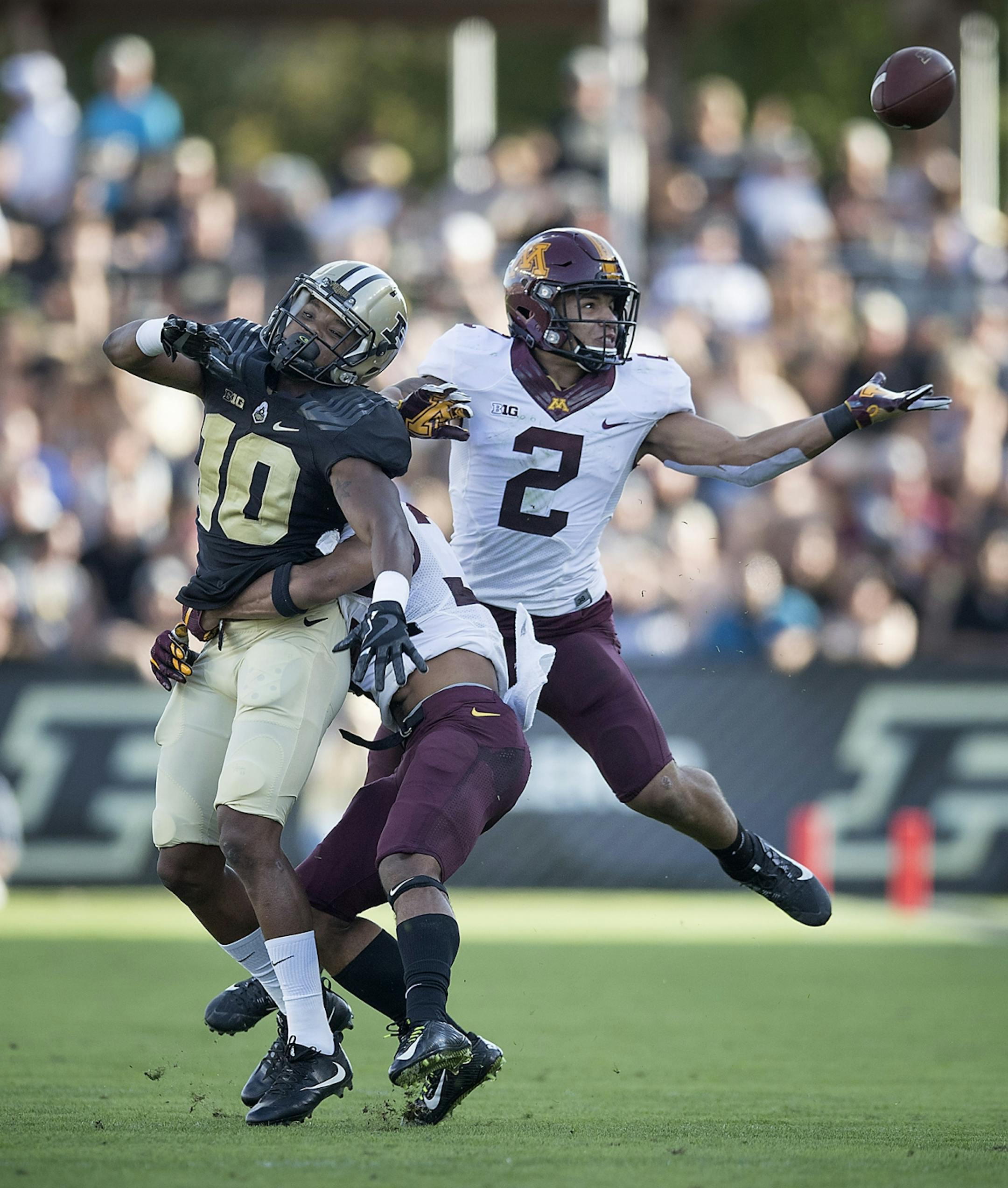 Minnesota's defensive back Antonio Shenault stopped Purdue's wide receiver Gregory Phillips giving Minnesota's defensive back Jacob Huff an attempt at an interception during the second quarter the Gophers took on Purdue at Ross-Ade Stadium, Saturday, October 7, 2017 in West Lafayette, IN.