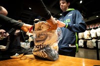 Steve Dockendorf of Prior Lake spent $300 on six Timberwolves shirts at theTimberwolves team store inside Target Center Wednesday, May 22, 2024, in Mi