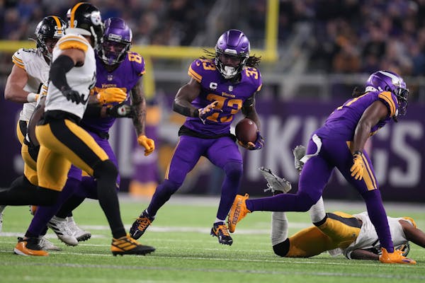 Minnesota Vikings running back Dalvin Cook (33) found a seam as he rushed the ball in the third quarter of an NFL game between the Minnesota Vikings a