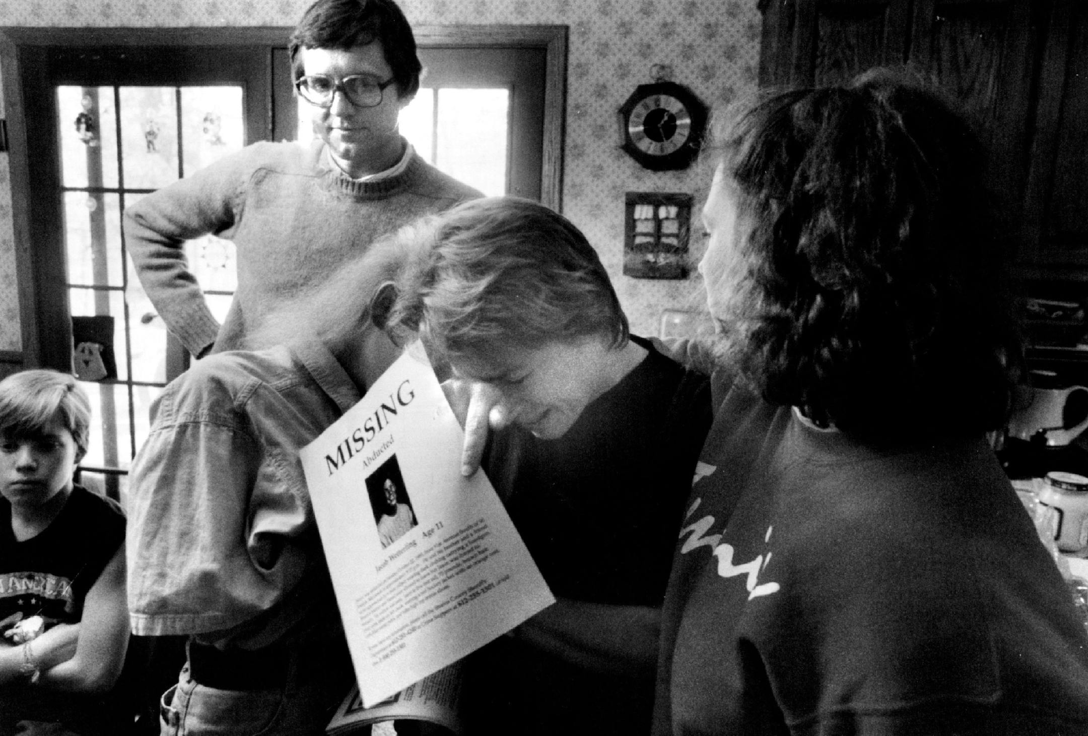 October 23, 1989 Jerry Wetterling watches in dispair as his wife Patty breaks down in tears upon seeing the missing persons poster of abducted 11-year-o1d son Jacob that volunteers began spreading throughout the state and natiion Monday afternoon. Jacob was abducted from a country road near his home at 29422 Kiwi Court in ST. Joseph, MN at about 9,15 Sunday evening. (The two young women comforting Mrs. Wetterlinq are Shannon Brannan, right, a former foster daughter of the Wetterlings and Lisa Ov