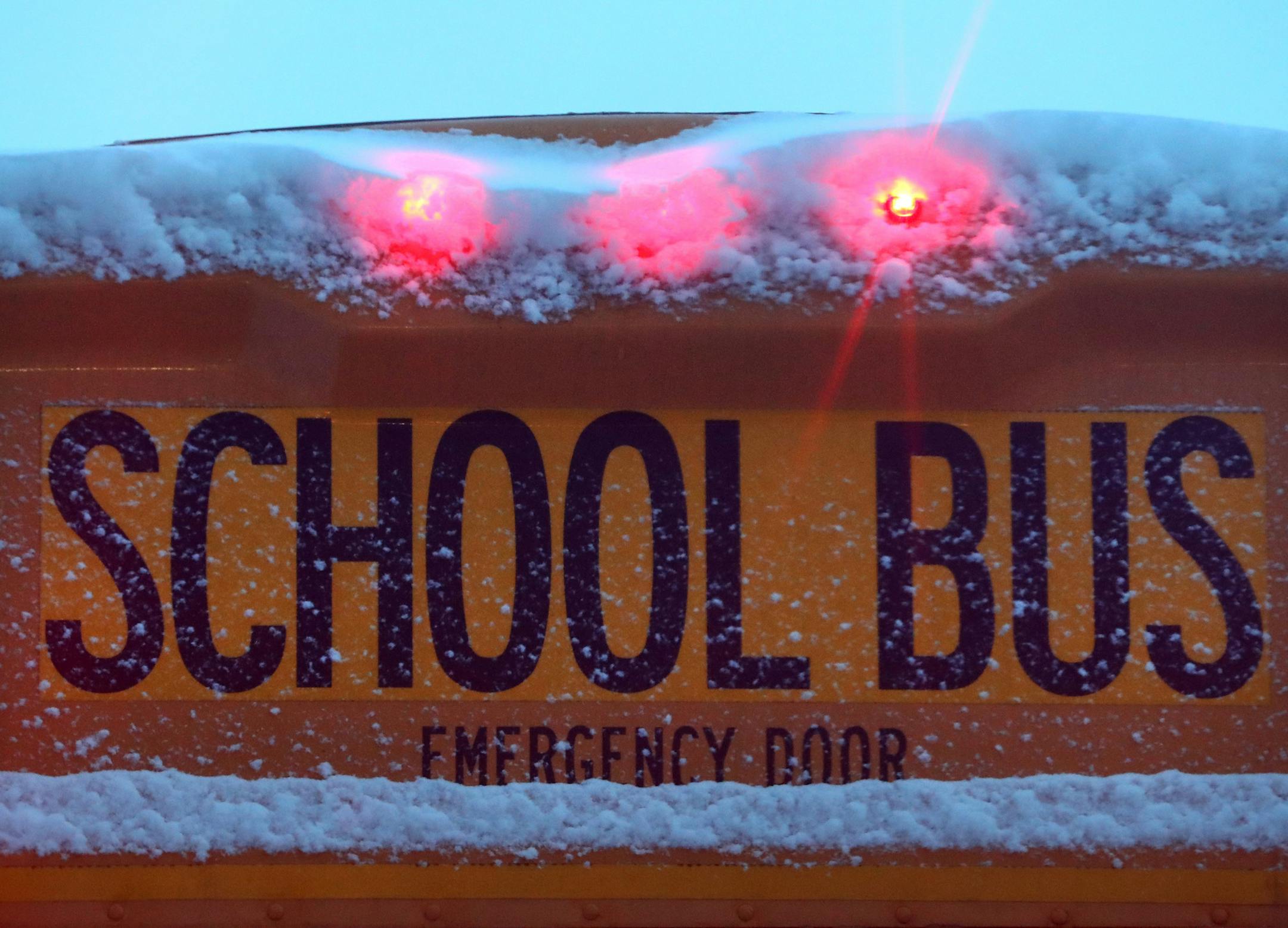 A school bus is coated in fresh snow on the first day of March Wednesday, March 1, 2017, in downtown Minneapolis, MN. De La Salle High School students are being told to stay home Wednesday after a "potential security threat" was made against the school by a student.] DAVID JOLES &#x2022; david.joles@startribune.com A fresh snow fall coated the sidewalks on first day of March in downtown Wednesday, March 1, 2017, in Minneapolis, MN.