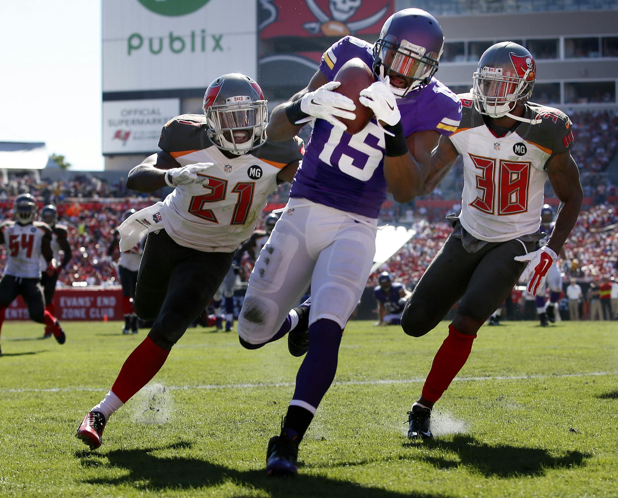 Greg Jennings (15) caught a 17-yard touchdown pass while being defended by Alterraun Verner (21) Dashon Goldson (38) in the third quarter. ] CARLOS GONZALEZ cgonzalez@startribune.com - October 26, 2014 , NFL, Tampa, FL, Raymond James Stadium, Tampa Bay Buccaneers vs. Minnesota