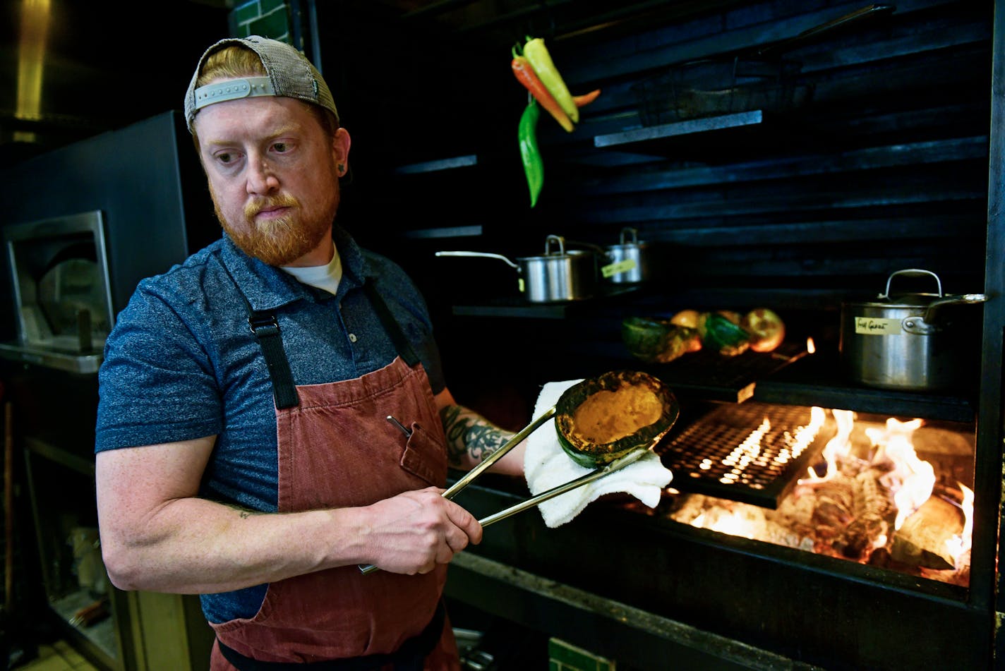 Jordan Hayes, the chef at the trendy Rosewild, in Fargo, N.D., Oct. 12, 2022. Hayes specializes in fermenting, smoking, curing and pickling. (Dan Koeck/The New York Times)