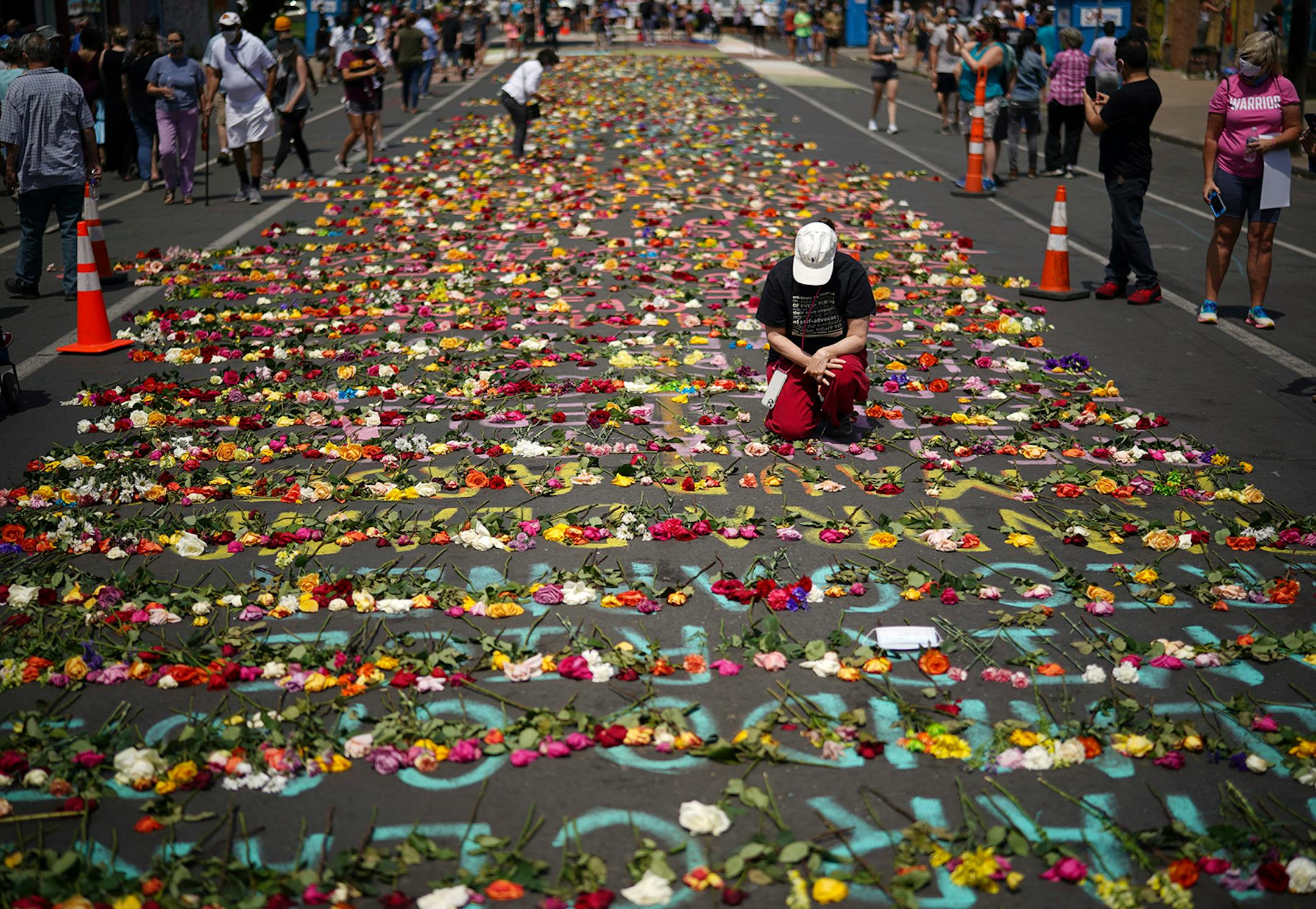 Visitors to the intersection where George Floyd was killed in Minneapolis were continuously leaving fresh flowers on the names of other victims of police violence on Sunday, June 7.