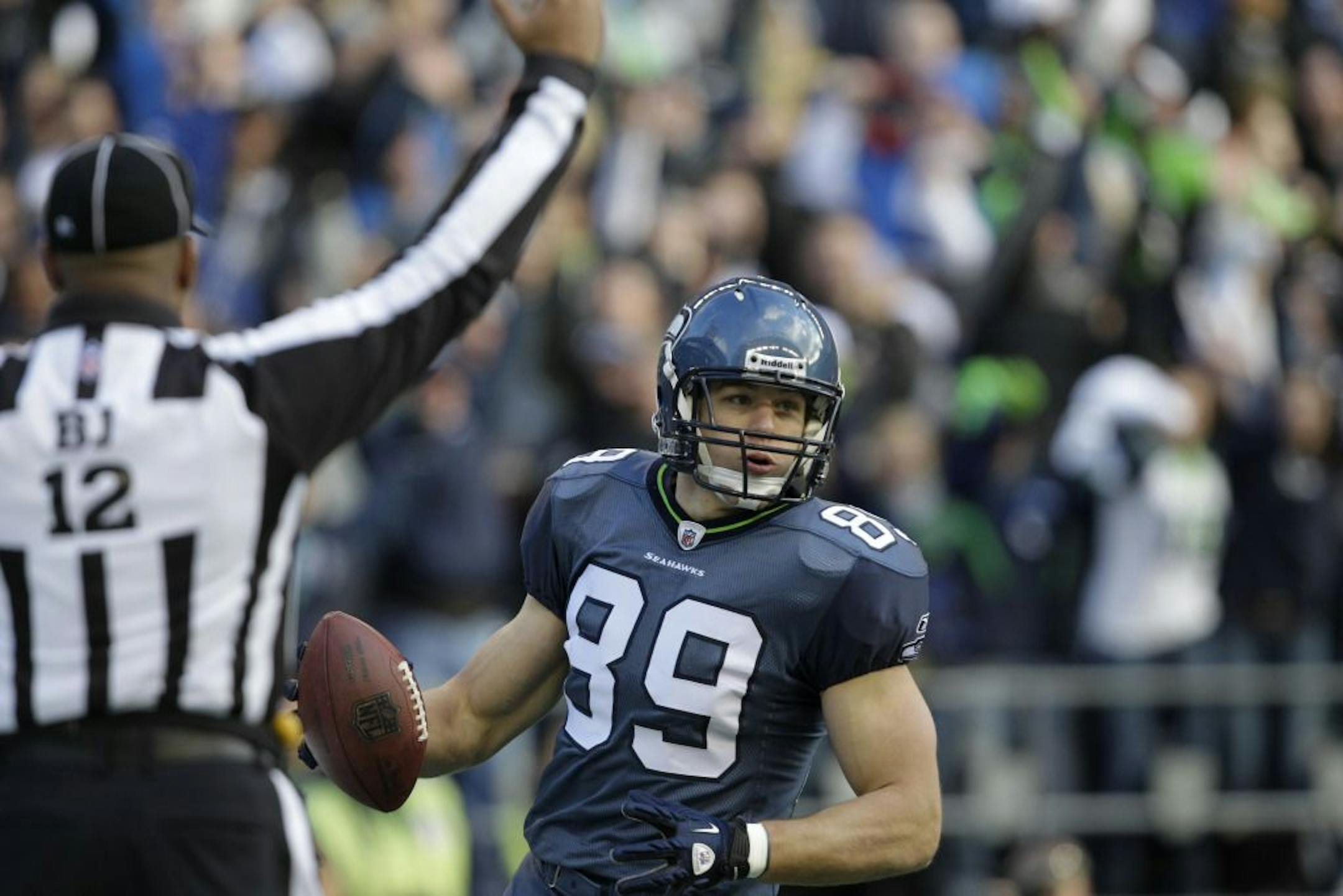Seattle Seahawks' John Carlson celebrates a touchdown in the first half of an NFL NFC wild card playoff football game against the New Orleans Saints, Saturday, Jan. 8, 2011, in Seattle.