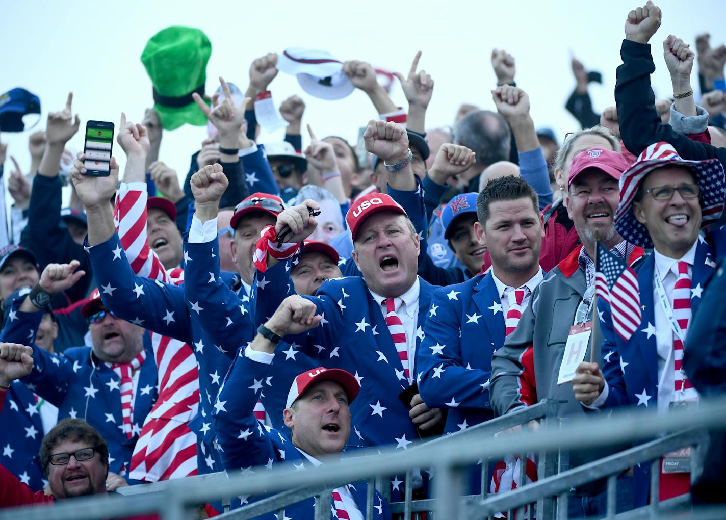 Fans, many keeping with the Ryder Cup tradition of over-the-top dress, celebrated at the first green at Hazeltine in Chaska. Many were up long before dawn and lined up by 5 a.m. to get choice seats.