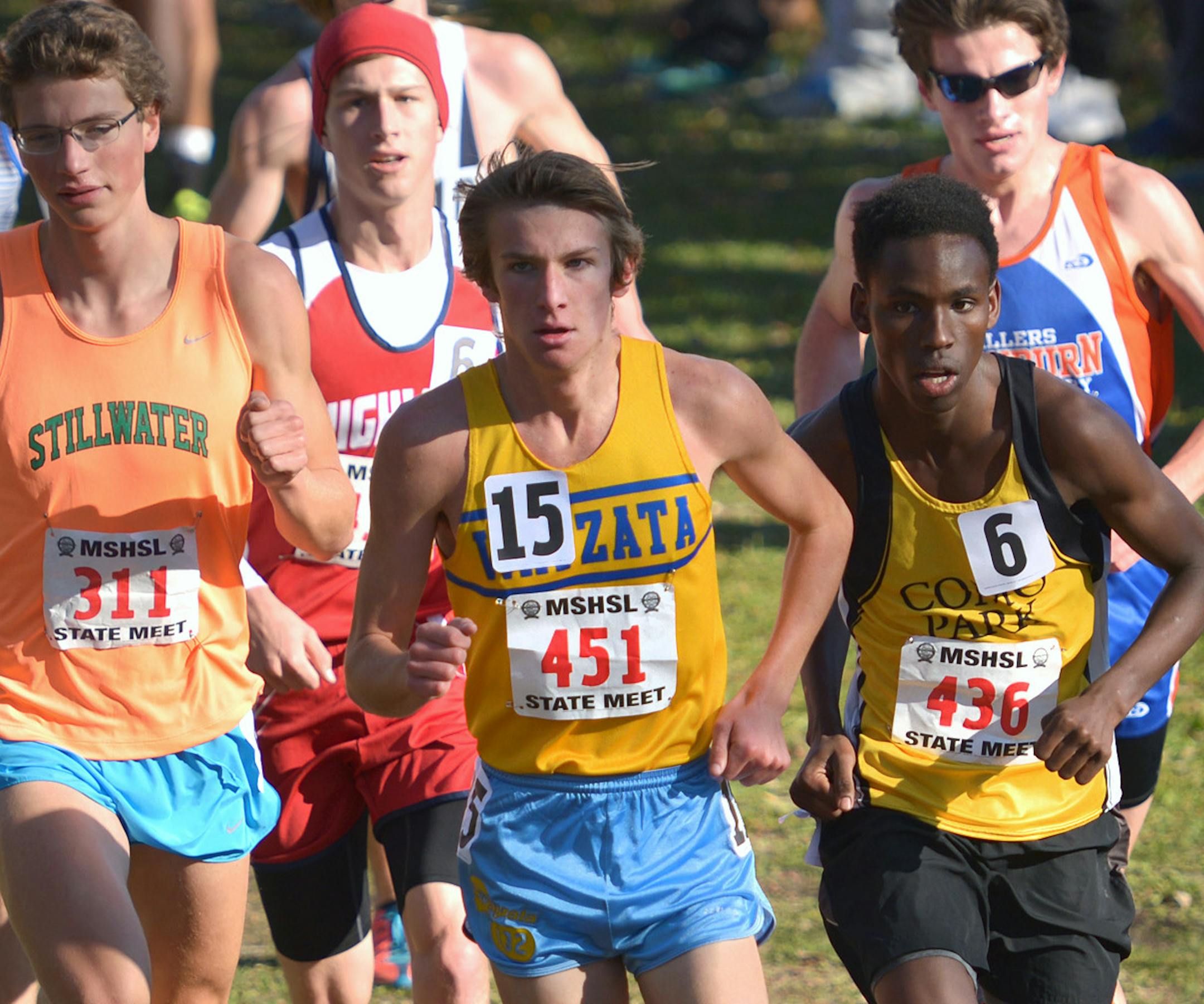 Wayzata senior Jaret Carpenter leads the boys' Class 2A cross country state tournament championship race Saturday, November 7 at St. Olaf College in Northfield. St. Paul Como Park junior Innocent Murwanashyaka (436) and Stillwater senior Eli Krahn (311) follow close behind. ] (SPECIAL TO THE STAR TRIBUNE/BRE McGEE) **Jaret Carpenter (Wayzata, 451), Innocent Murwanashyaka (St. Paul Como Park, 436), Eli Krahn (Stillwater, 311)