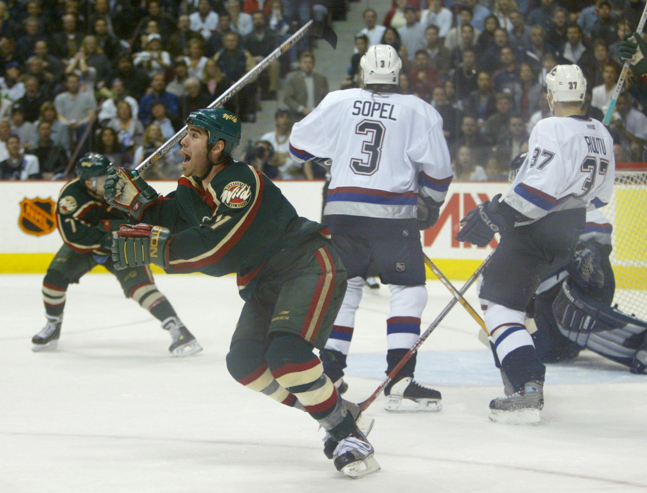 VANCOUVER - 5/8/03 - The Minnesota Wild and the Vancouver Canucks battled in their seventh and final game of their NHL playoff series at G.M Place in Vancouver Thursday night. IN THIS PHOTO: Pascal Dupuis of the Wild celebrates his second period goal. ORG XMIT: MIN2013050115174179
