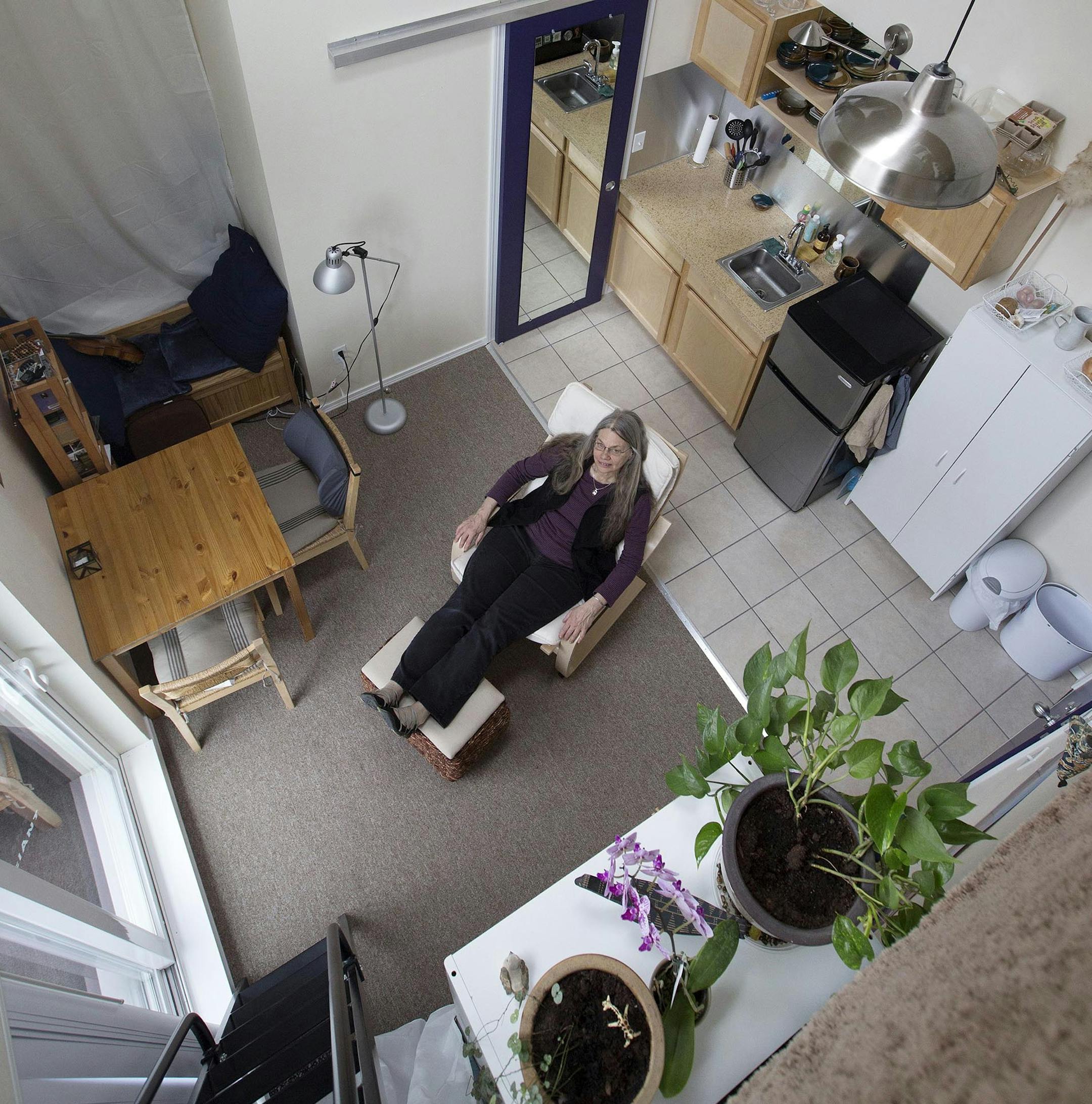 Judy Green sits in the living room area of her 200-square-foot apartment in Sammamish, Washington, which features a cathedral ceiling with a sleeping loft. (Steve Ringman/Seattle Times/MCT) ORG XMIT: 1138026