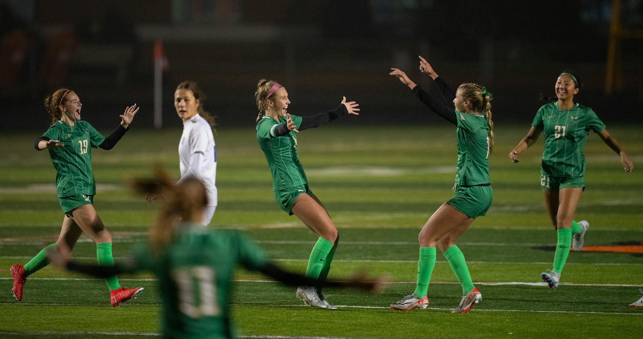 Edina's Izzy Engle (3), with the pink headband, celebrated the third goal of her hat trick in the second half.