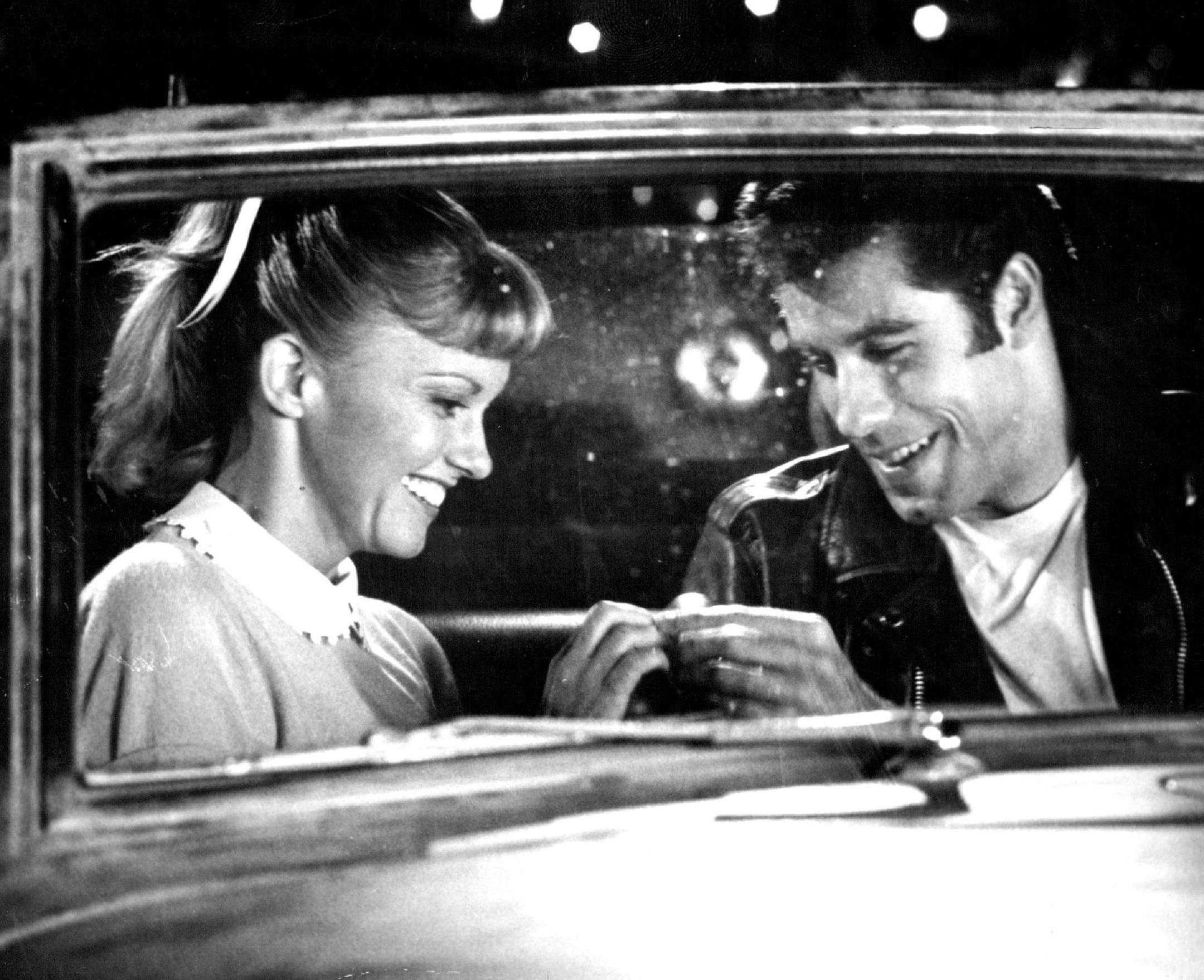 June 22, 1978 Olivia Newton-John and John Travolta in "Grease." A Robert Stigwood/Allan Carr Production For Paramount Pictures. "Grease." Starring John Travolta Olivia Newton-John. Also Starring Stockard Channing as Rizzo. Screenplay by Bronte Woodard, Adaptation by Allan Carr Based on the Original Musical By Jim Jacobs & Warren Casey Produced on the Broadway Stage by Kenneth Waissman and Maxine Fox In Association With Anthony D'Amato. Directed by Randal Kleiser. Produced by Robert Stigwood and