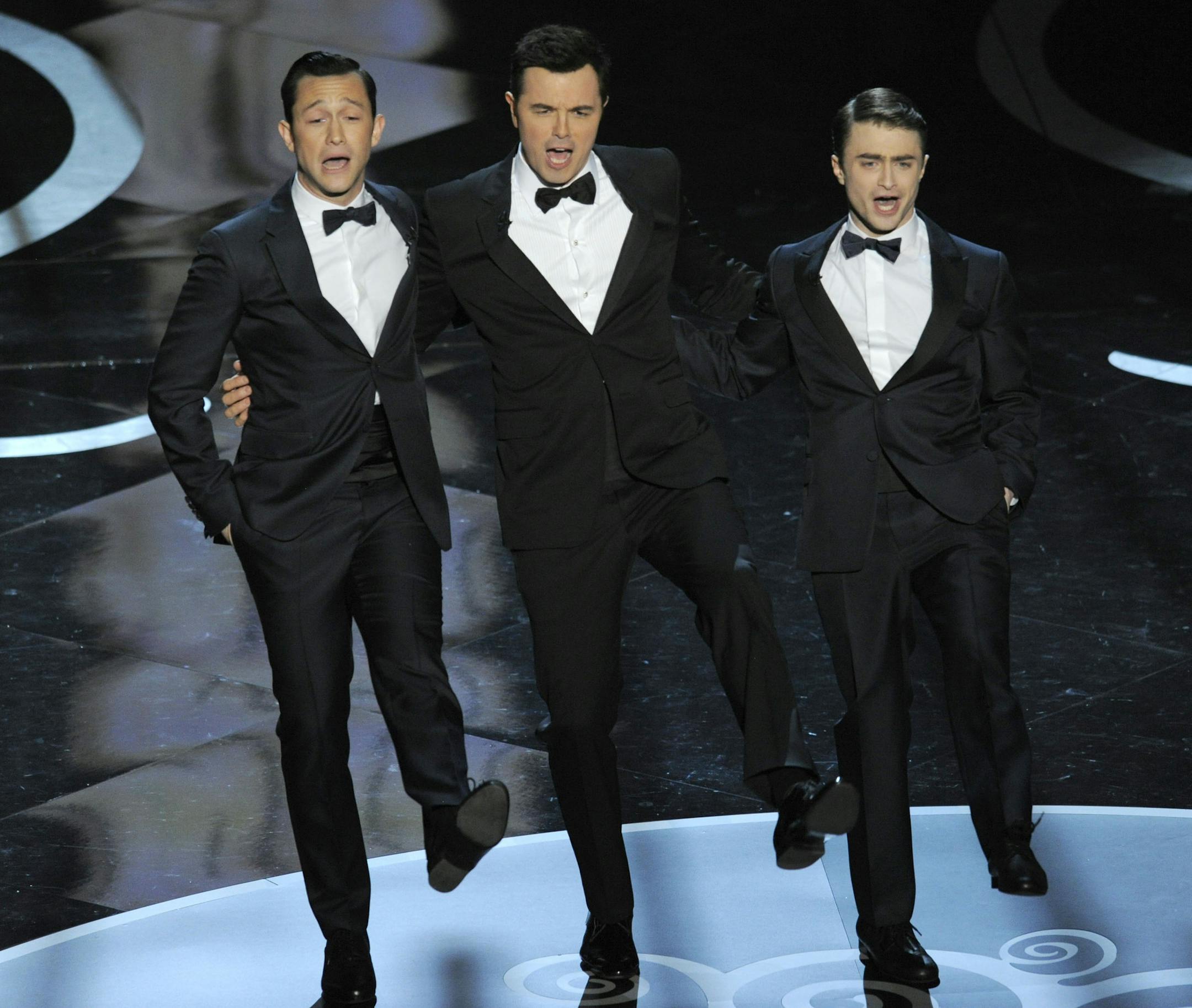 Actors, from left, Joseph Gordon-Levitt, host Seth MacFarlane and Daniel Radcliffe perform during the Oscars at the Dolby Theatre on Sunday Feb. 24, 2013, in Los Angeles. (Photo by Chris Pizzello/Invision/AP)