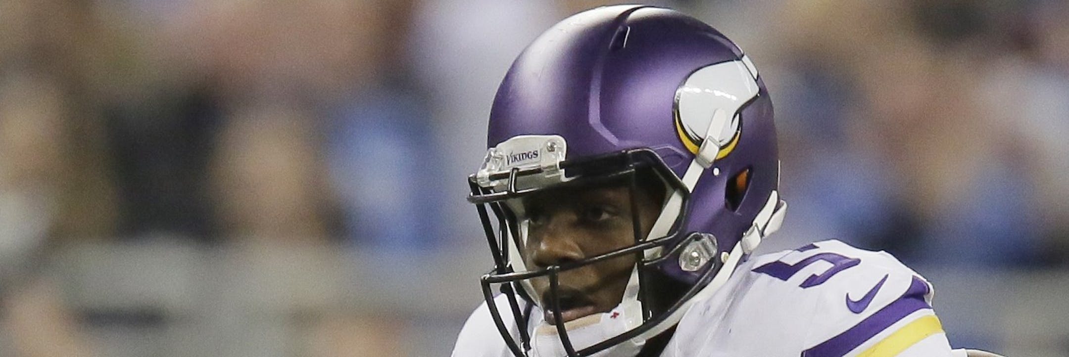 Minnesota Vikings quarterback Teddy Bridgewater (5) scrambles during the second half of an NFL football game against the Detroit Lions at Ford Field in Detroit, Sunday, Dec. 14, 2014. (AP Photo/Duane Burleson)