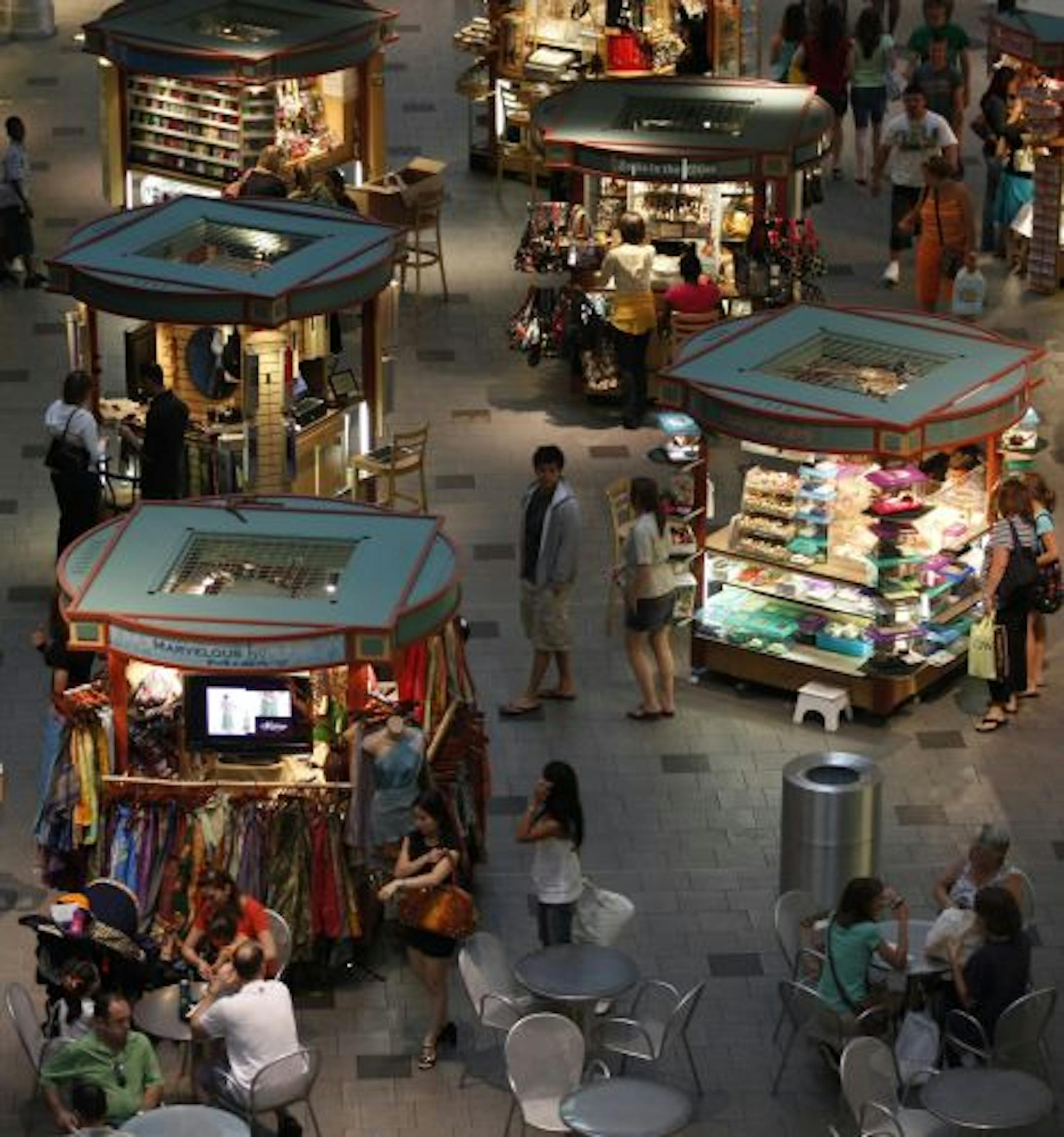 Mallgoers visit the various vendor stands Friday afternoon at the Mall of America in Bloomington.