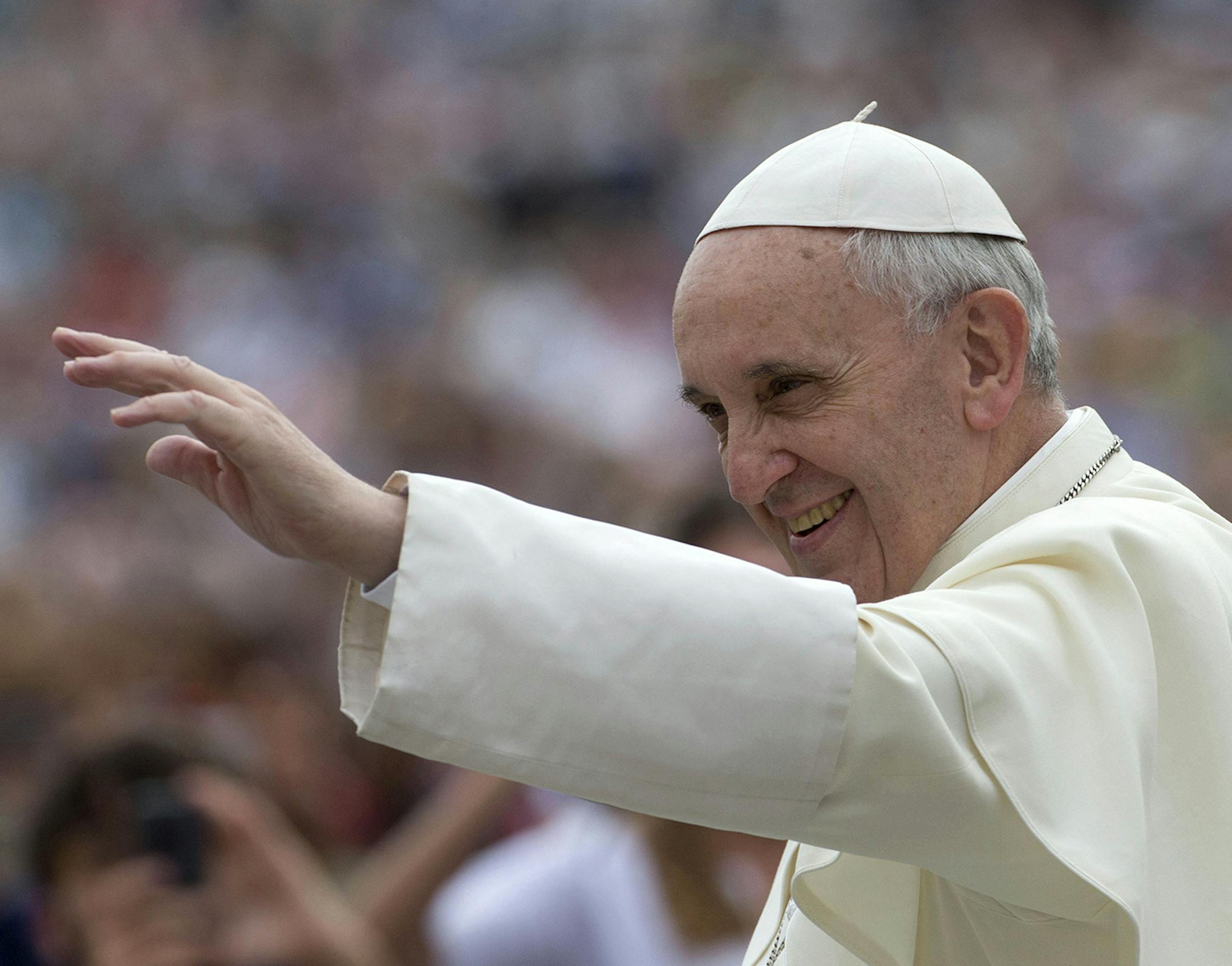 Pope Francis arrives for his weekly general audience in St. Peter's Square, at the Vatican, Wednesday, Sept. 11, 2013. During open-air general audiences the pontiff is driven through the crowd in his car before delivering his message to attendees from the square in front of St. Peter's Basilica. (AP Photo/Alessandra Tarantino) ORG XMIT: MIN2013100113525736