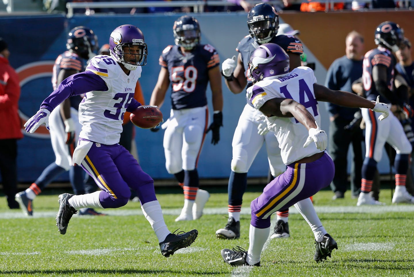 Minnesota Vikings' Marcus Sherels (35) celebrates with Stefon Diggs (14) after returning a punt for a touchdown during the first half of an NFL football game against the Chicago Bears, Sunday, Nov. 1, 2015, in Chicago. (AP Photo/Charles Rex Arbogast)