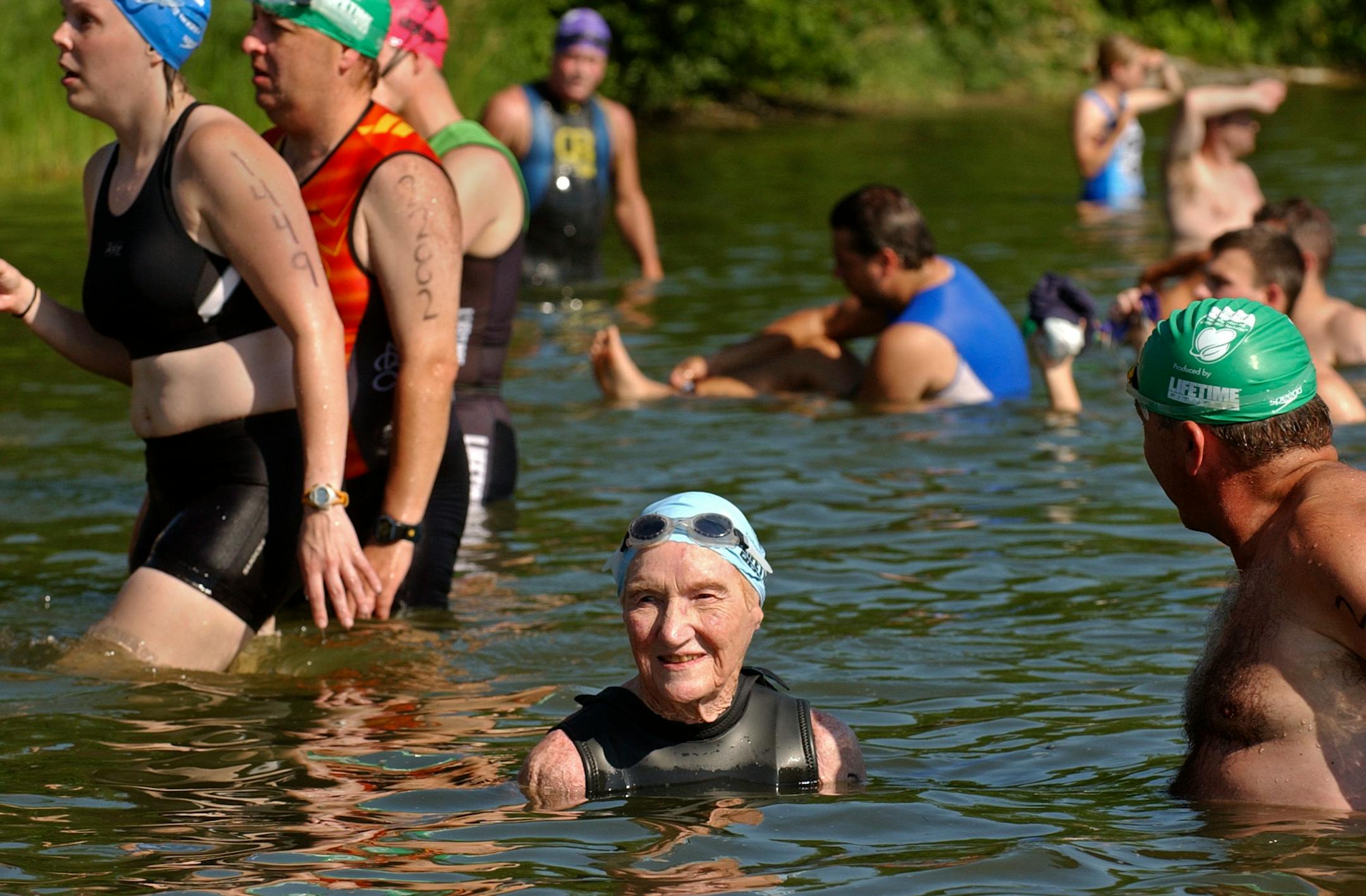 JOEY MCLEISTER � jmcleister@startribune.com Minneapolis,Mn.,Sat.,July 15, 2006--(Left to right) Mary Stroebe and her son, Bruce Stroebe, wade into Lake Nokomis to start the 2006 Life Time Fitness Triathlon. Mary Stroebe (from Madison, Wisconsin) is 88 years old and this was her 12th triathlon. Stroebe has finished the Life Time Fitness Triathlon first in her age group for the last four years in a row.(NOTE--I don't know how she did this year.) Her son competes alongside her.
GENERAL INFORMATION:
