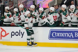Wild left wing Kevin Fiala is congratulated by teammates after his goal against the San Jose Sharks on Thursday.