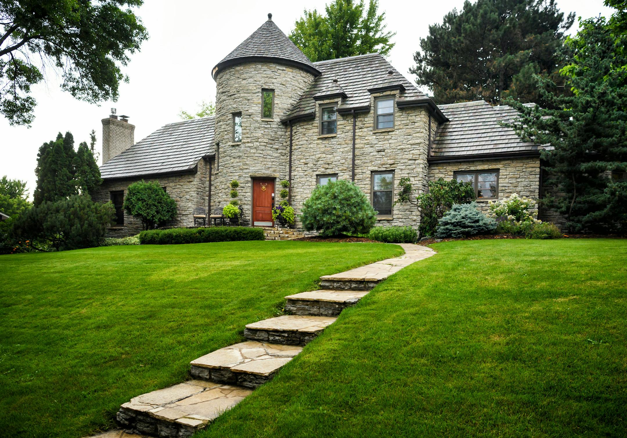 “The Castle,” a French Norman-style house in Golden Valley, is a local landmark — clad in stone, with a turret and tile roof.
