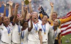 Megan Rapinoe holds the trophy celebrating at the end of the Women's World Cup final soccer match between US and The Netherlands.
