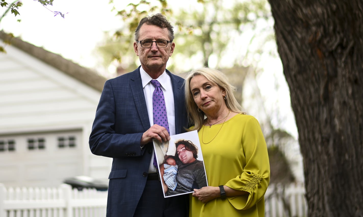 Stephen and DeeDee Tillitt held a photo of their son Max outside DeeDee's Edina home.