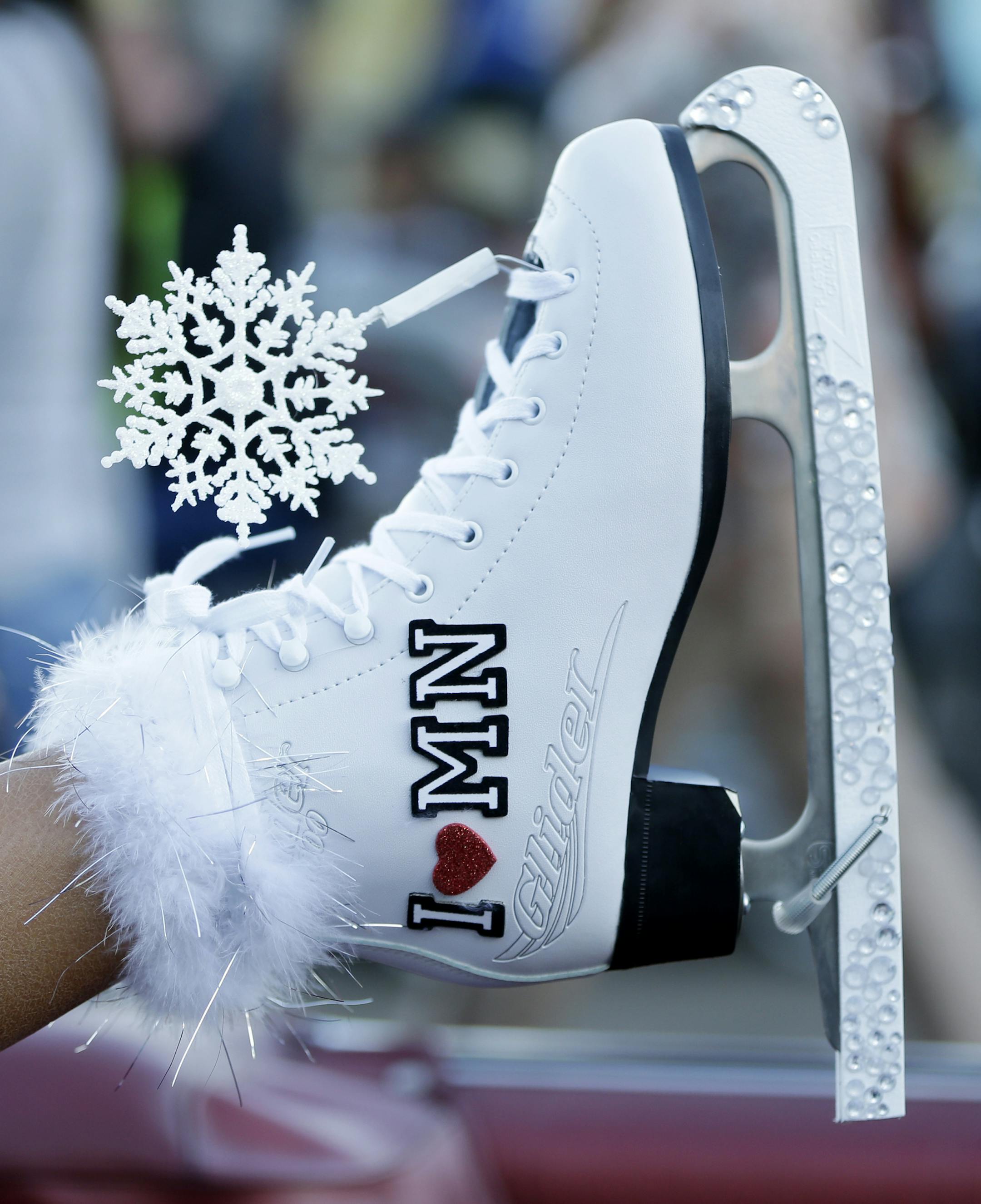 Miss Minnesota Rebecca Yeh displays her shoe during the Miss America Shoe Parade at the Atlantic City boardwalk, Saturday, Sept. 14, 2013, in Atlantic City, N.J. (AP Photo/Julio Cortez)