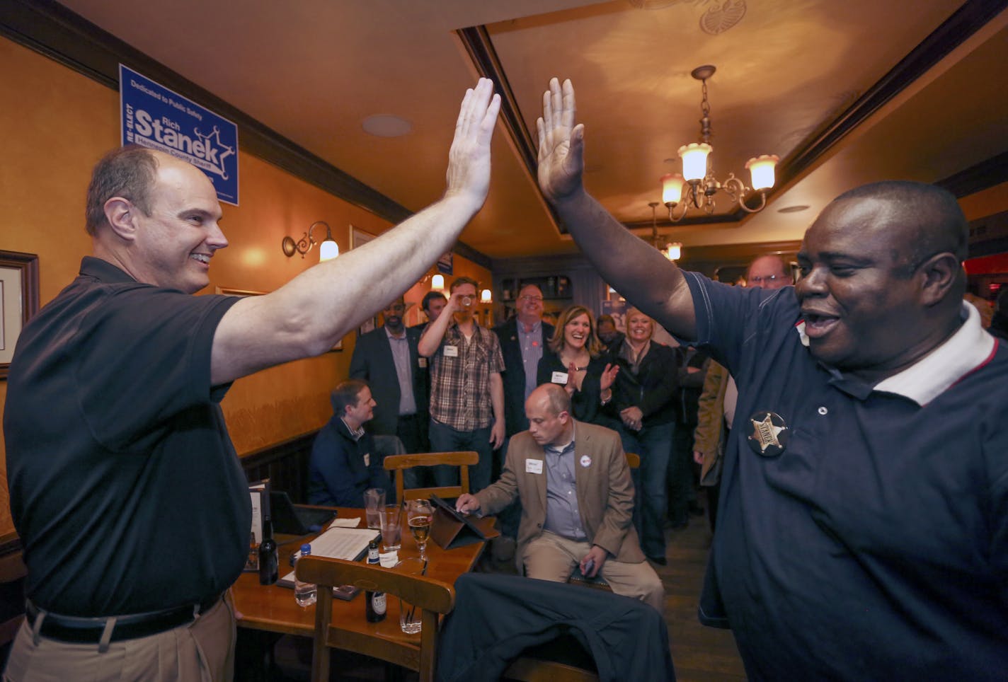 Hennepin County incumbent Sheriff Rich Stanek celebrated his victory with supporter Pastor Harding Smith at an election night party at Kip's Irish Pub in St. Louis Park, Minn., on Tuesday, November 4, 2014. ] RENEE JONES SCHNEIDER &#x201a;&#xc4;&#xa2; reneejones@startribune.com ORG XMIT: MIN1411042206374992