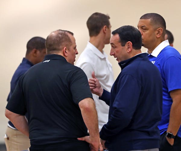 New Wolves coach Tom Thibodeau, left, talked with Duke and Team USA head coach Mike Krzyzewski at Tuesday's practice. Former Wolves coach Randy Wittma