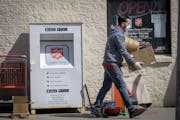 Salvation Army employee Sean Graham grabbed donations being dropped off to the donation center, Wednesday, April 1, 2020 in downtown Minneapolis.