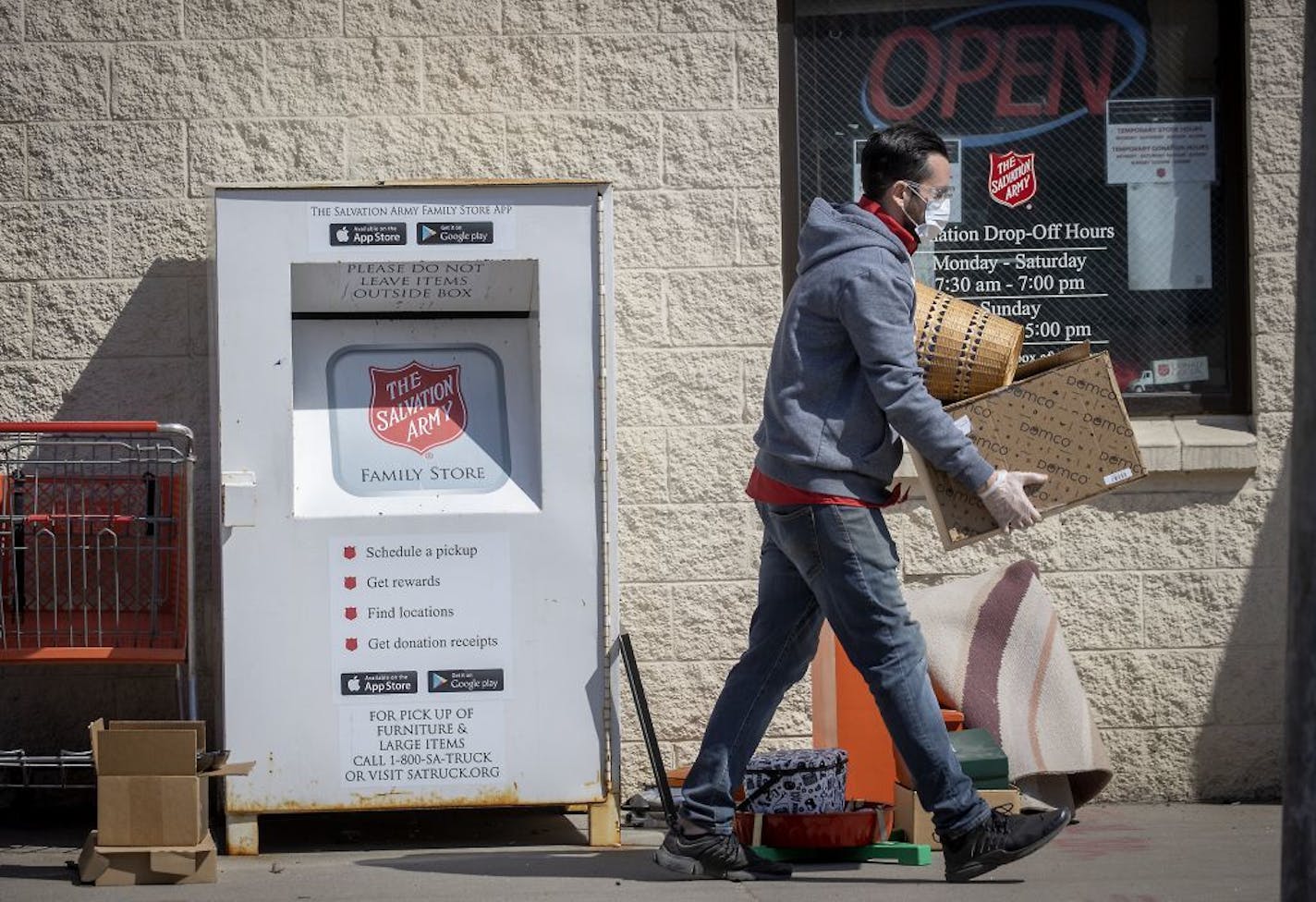 Salvation Army employee Sean Graham grabbed donations being dropped off to the donation center, Wednesday, April 1, 2020 in downtown Minneapolis.