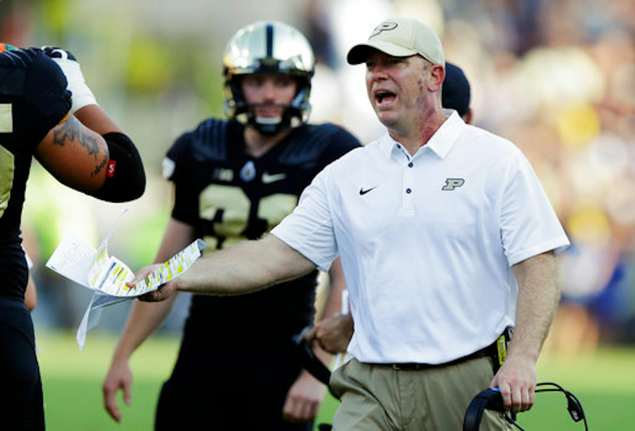 FILE - In this Sept. 23, 2017, file photo, Purdue head coach Jeff Brohm yells to an official during the first half of an NCAA college football game against Michigan in West Lafayette, Ind. Indiana and Purdue head into their regular-season finale with the same Bucket list. Indiana plays Purdue on Saturday, Nov. 25, 2017. (AP Photo/Michael Conroy, File)