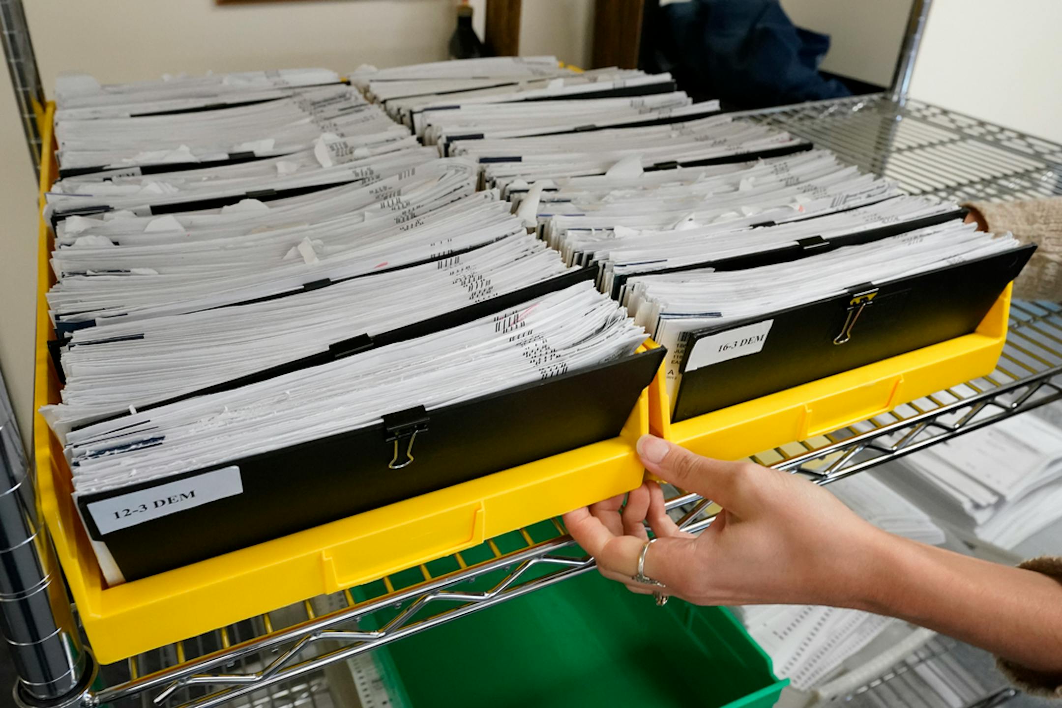 Monroe County municipal workers handle ballots as vote counting in the general election continues, Thursday, Nov. 5, 2020, in Stroudsburg, Pa. (AP Photo/Mary Altaffer)