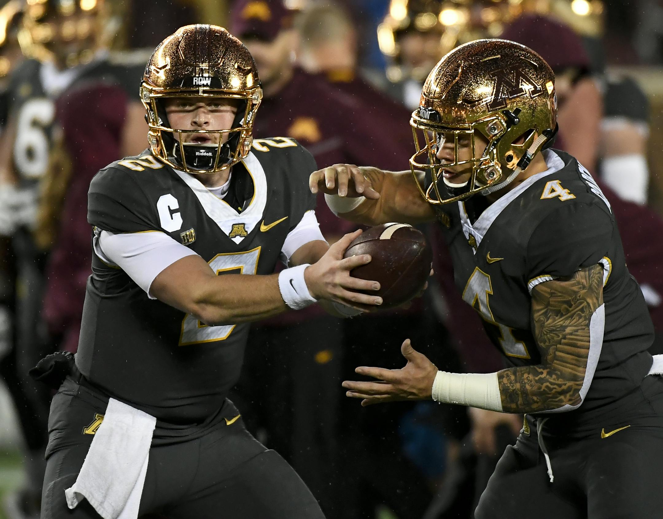 Minnesota Golden Gophers quarterback Tanner Morgan (2) handed off the ball to running back Shannon Brooks (4) during warmups before the start of Friday night's game against the Indiana Hoosiers. ] Aaron Lavinsky • aaron.lavinsky@startribune.com The University of Minnesota Golden Gophers football team played the Indiana Hoosiers on Friday, Oct. 26, 2018 at TCF Bank Stadium in Minneapolis, Minn.