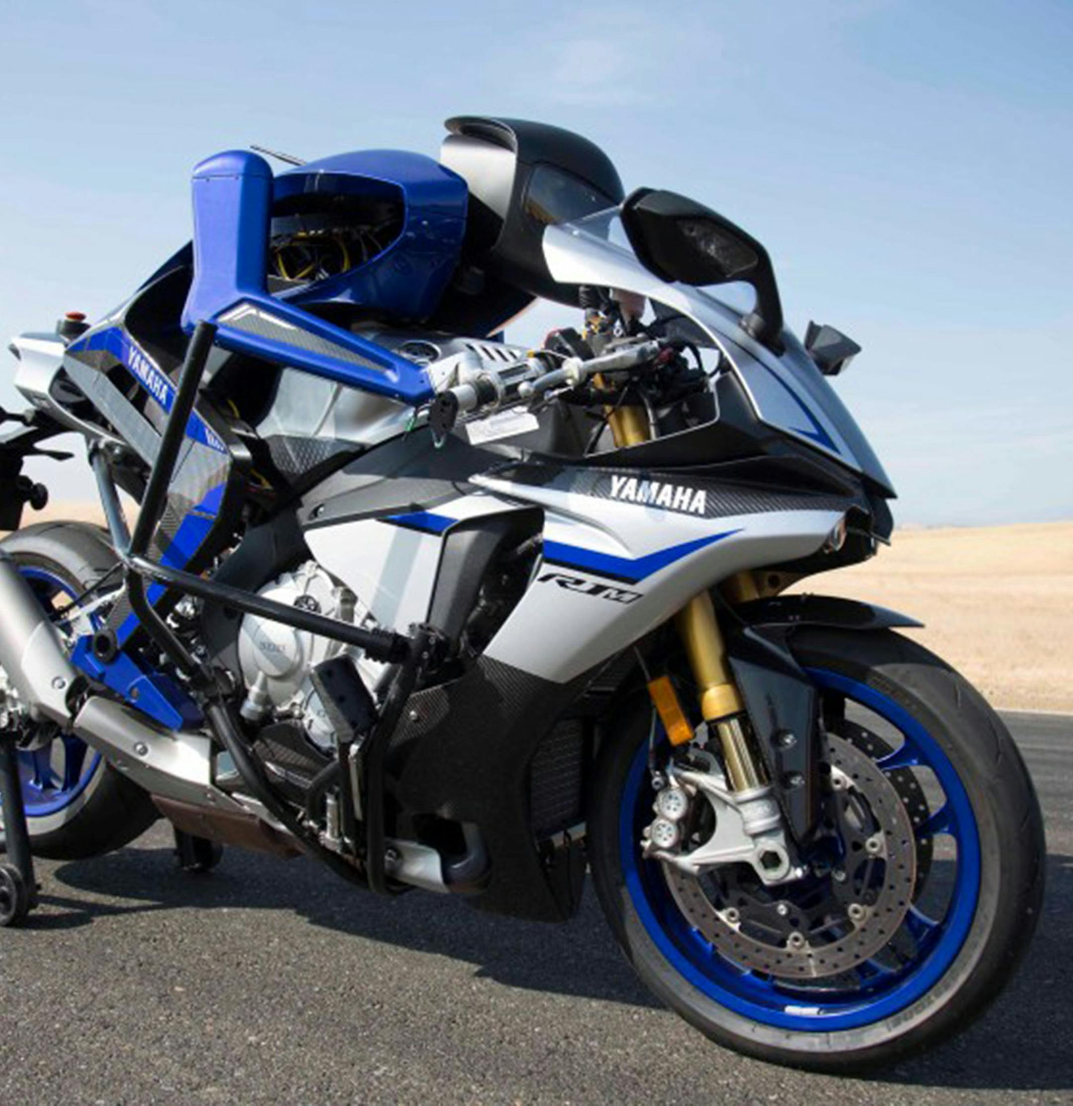 Motobot 2.0, a joint research project of SRI International and Yamaha Motor Ventures in Menlo Park, is shown in a promotional image. The 2-year-old Motobot project, which in its second iteration recently achieved speeds higher than 200 kilometers per hour (124 mph), employs a humanoid robot on an unmodified Yamaha YZF-R1M to test ways to increase performance and speed while boosting ridership safety. (SRI International)