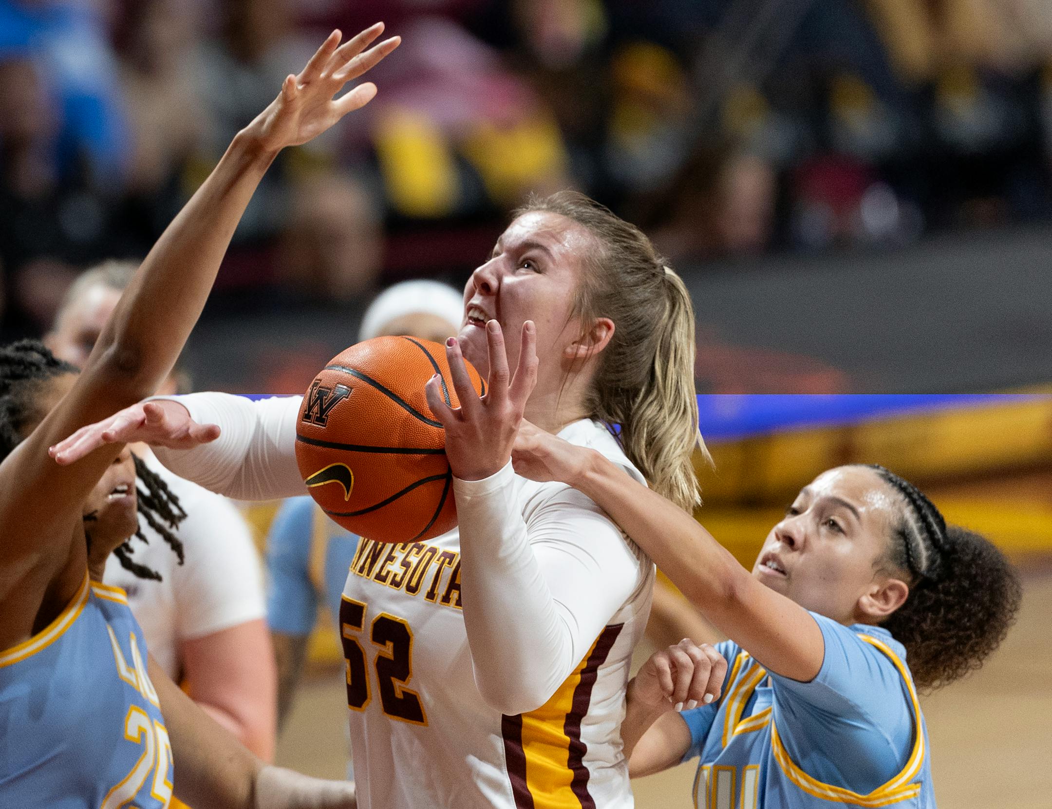 Sophie Hart (52) of Minnesota was fouled by Mariah Elohim (11) of Long Island in the fourth quarter Wednesday, November 8, 2023, at Williams Arena in Minneapolis, Minn. ] CARLOS GONZALEZ • carlos.gonzalez@startribune.com