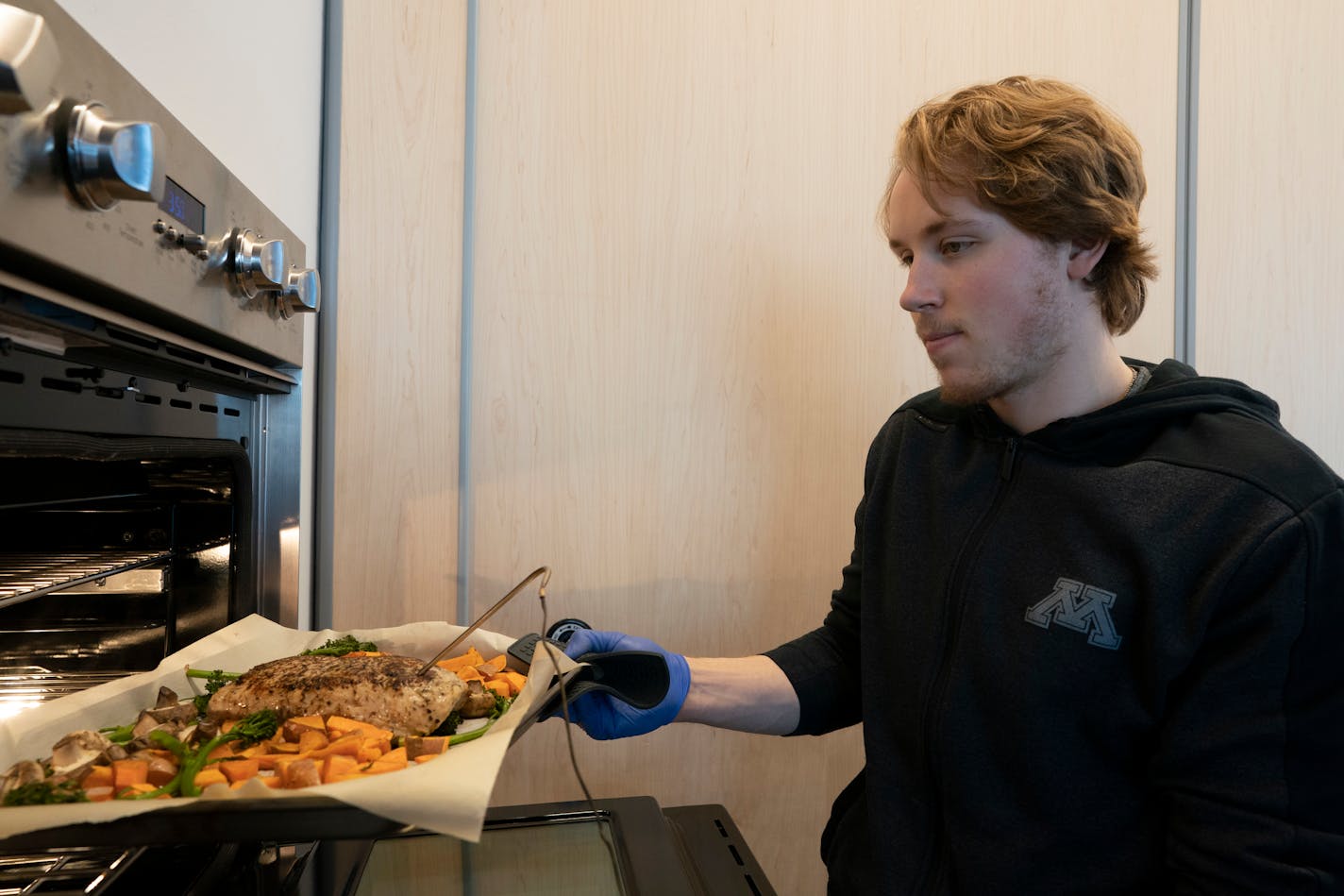 Rem Pitlick, the No. 1 center for the Gophers hockey team, knows his way around the kitchen and often eats at home instead of at the dining hall.