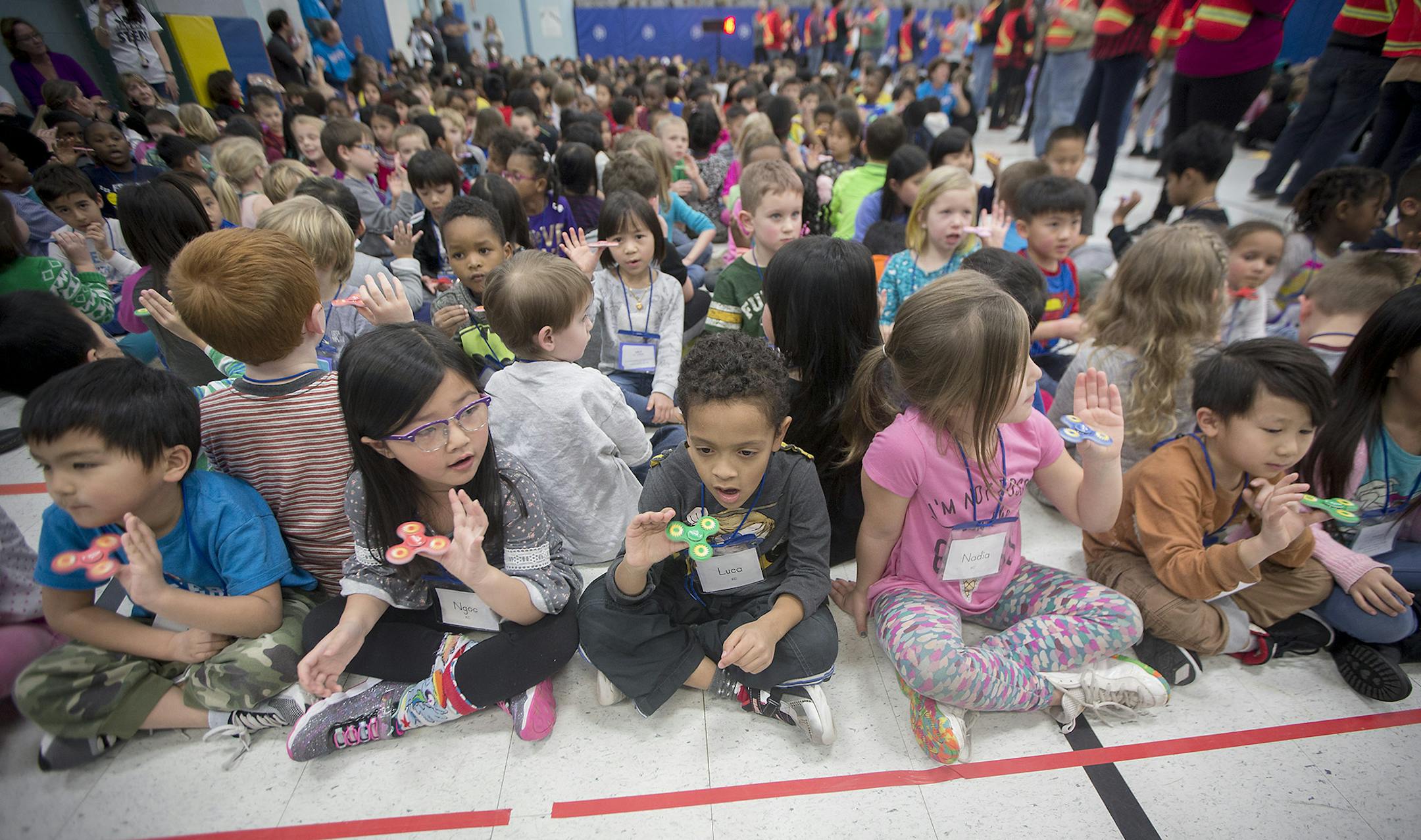 Monroe Elementary School students, consisting of more than 650 students, attempted to set a world record with fidget spinners in the school's gym, Thursday, December 21, 2017 in Brooklyn Park, MN. ] ELIZABETH FLORES ï liz.flores@startribune.com