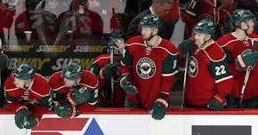 Wild players watched as the Coyotes won a shootout Monday night at the Xcel Energy Center.