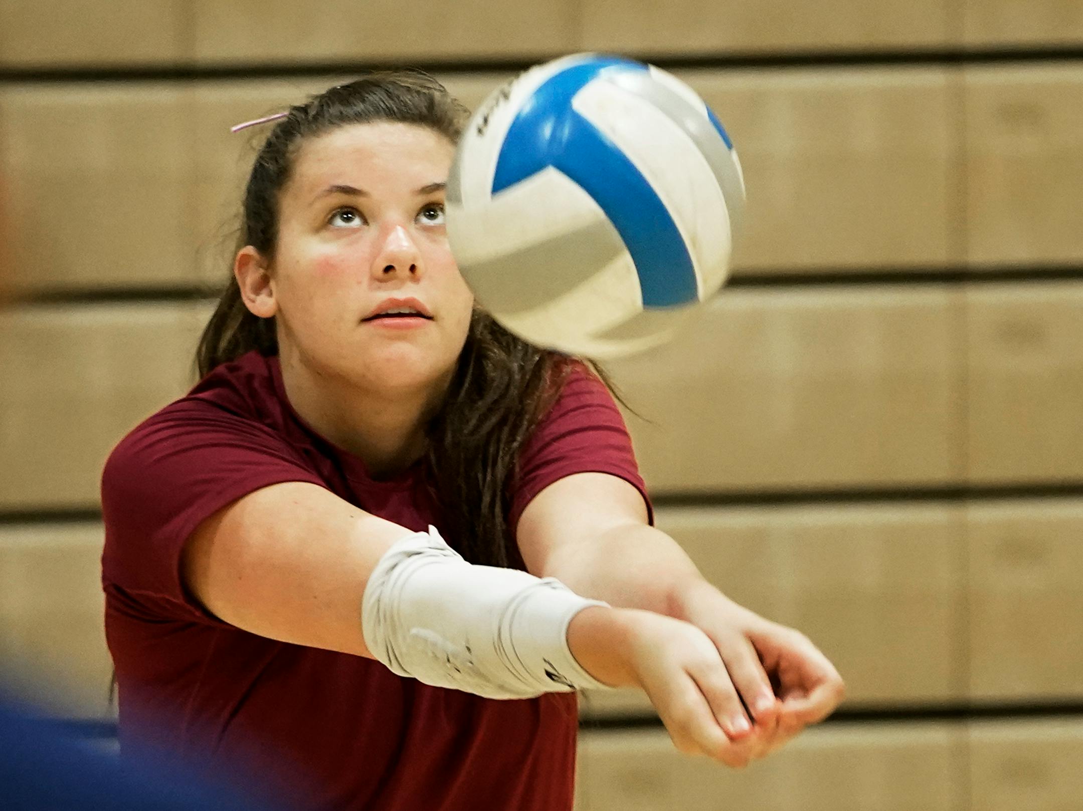Wayzata High girls volleyball player Olivia Swenson bumps a shot during the first day of practice.