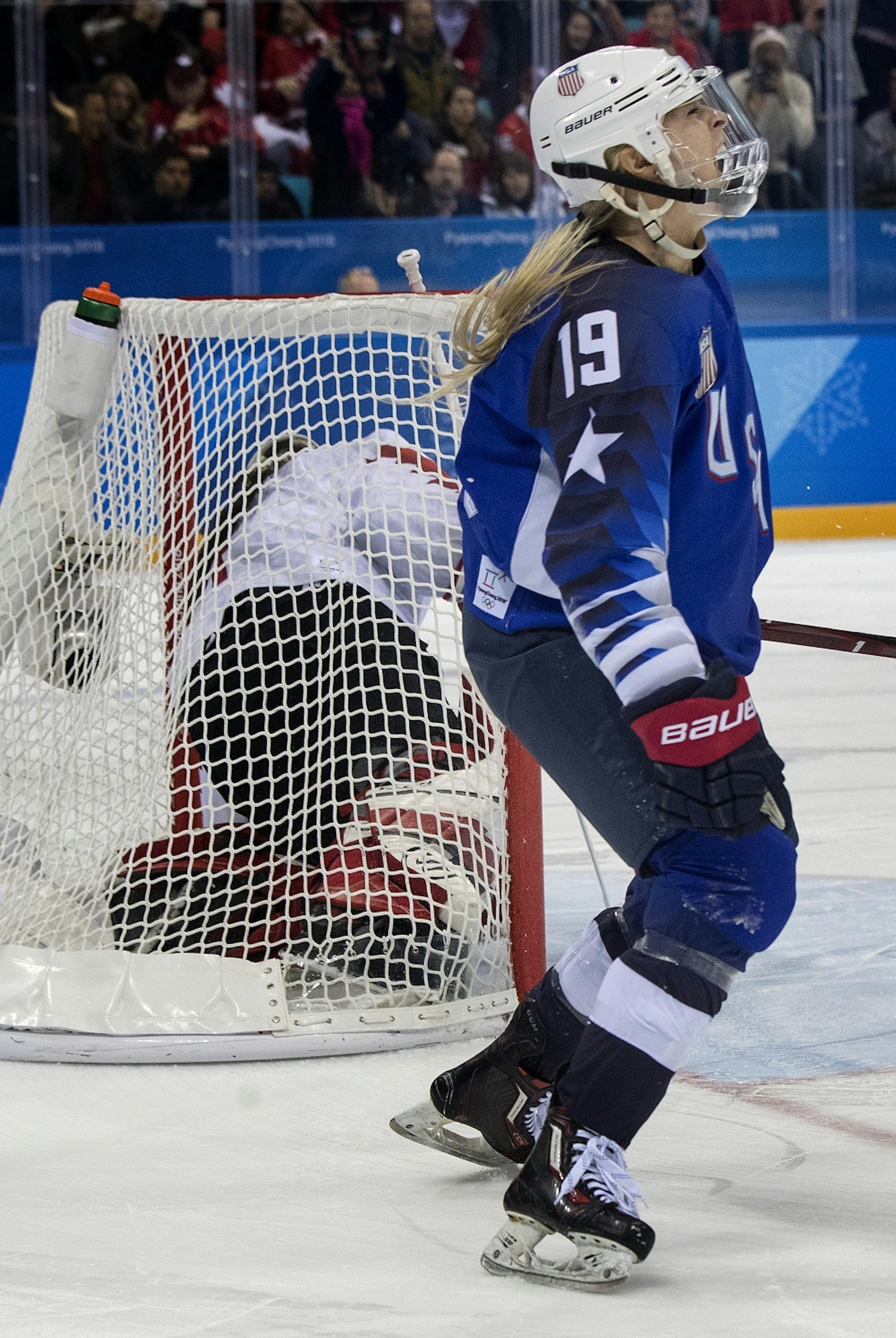 Gigi Marvin (19) celebrated after shooting the puck past Canada goalie Shannon Szabados (1) during the shootout.