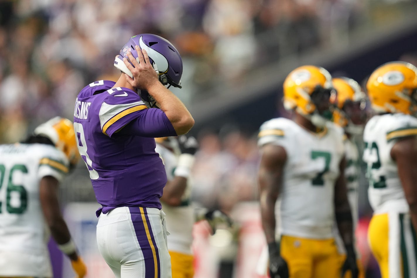 Minnesota Vikings quarterback Kirk Cousins (8) tries to hear the ear set in his helmet early in the second quarter of the Minnesota Vikings season opener against the Green Bay Packers Sunday, Sept. 11, 2022 at U.S. Bank Stadium in Minneapolis. ] ANTHONY SOUFFLE • anthony.souffle@startribune.com