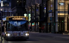 Metro Transit busses with the hashtag #STAYHOMEMN on Nicollet Mall in downtown Minneapolis on Monday evening. ] CARLOS GONZALEZ &#x2022; cgonzalez@sta