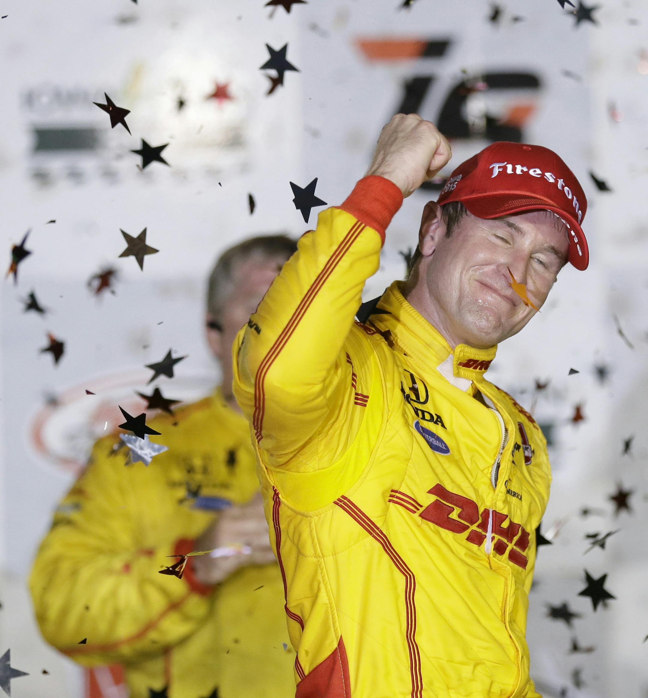 Ryan Hunter-Reay celebrates in Victory Lane after winning the IndyCar Series auto race Saturday, July 18, 2015, at Iowa Speedway in Newton, Iowa. (AP Photo/Charlie Neibergall)