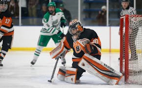 White Bear Lake goalie Tyler Steffens prepared to make a save against Hill-Murray during the Bears' 3-2 overtime win on Tuesday night at Aldrich Arena