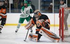 White Bear Lake goalie Tyler Steffens prepared to make a save against Hill-Murray during the Bears' 3-2 overtime win on Tuesday night at Aldrich Arena