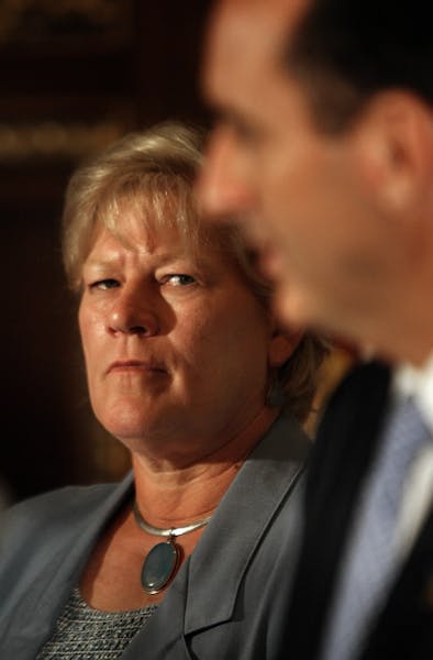 The governor and Lt. Gov. Carol Molnau, who at the time also served as state transportation commissioner, at a news conference after the collapse of t