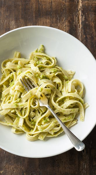 Garlic Scape Pesto gives pasta a fresh taste.