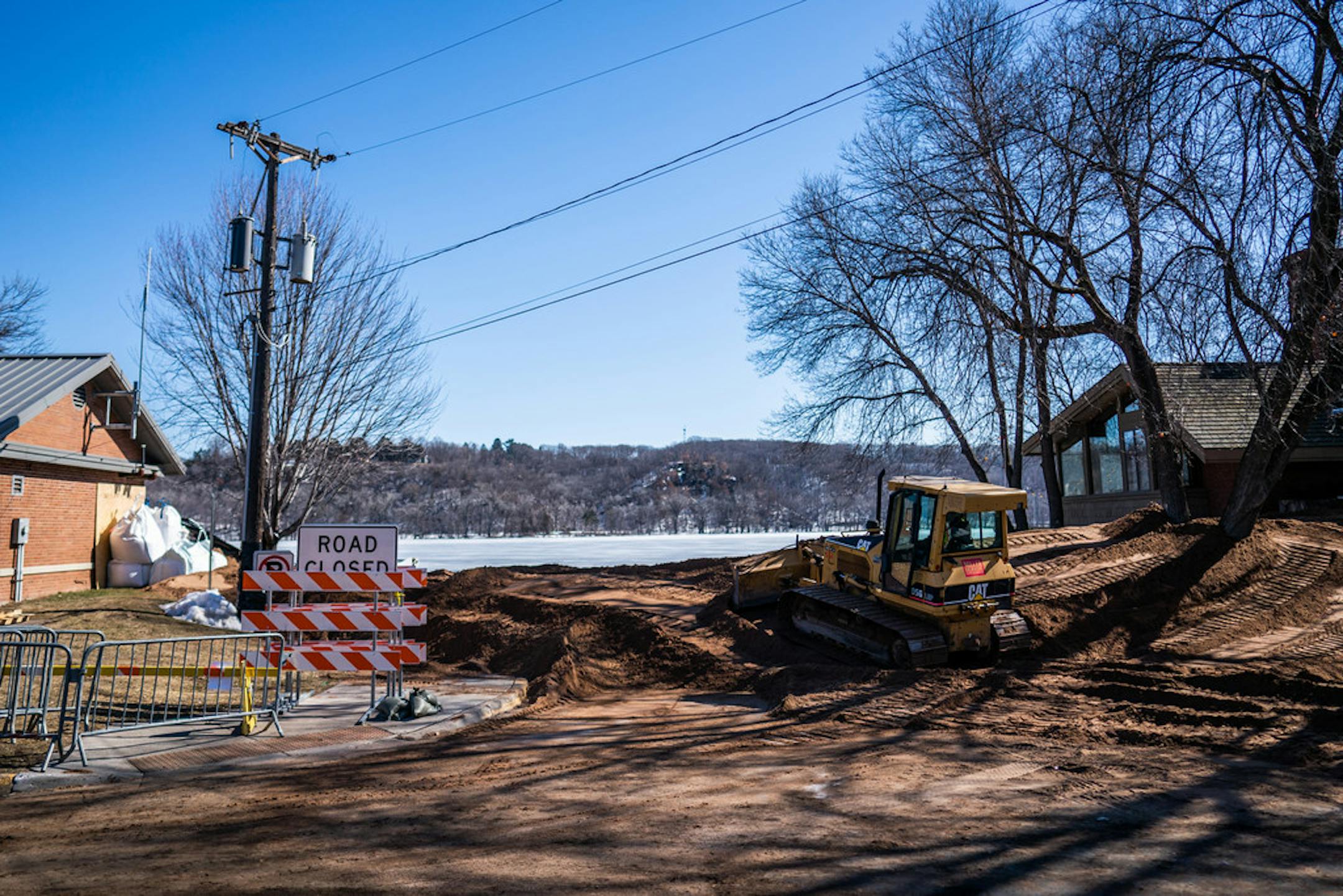 Crews erected an earth levy to fight flooding on the St. Croix River in 2019. The river is expected to hit minor flood stage this weekend.